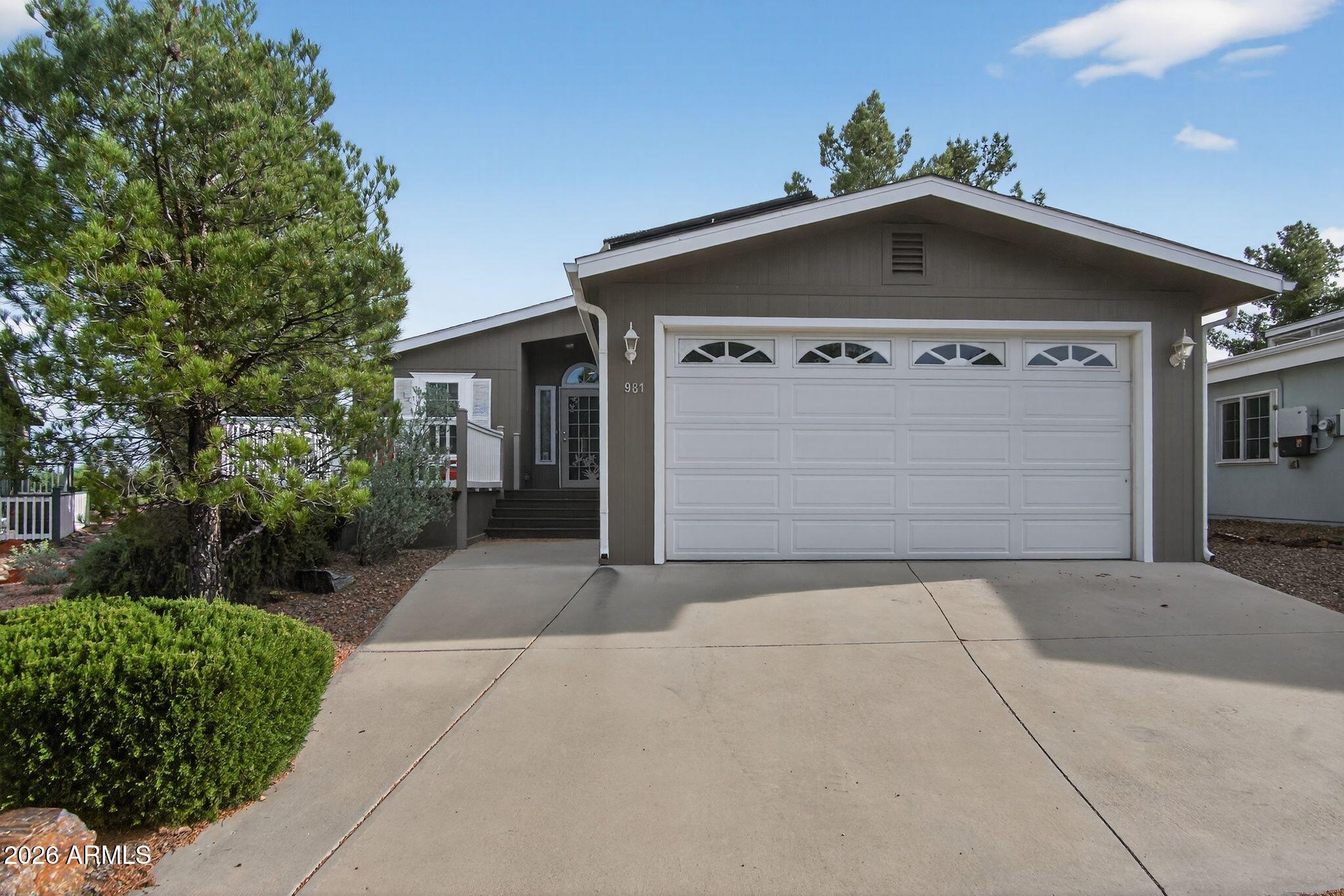 On Leased Land: On Golf course living in sought-after 55+ community--just steps from clubhouse!  Paid-in-full solar panels offer energy efficiency w/ estimated monthly savings on electric bills (buyer to verify)This 2 bed, 2 bath home w/ a spacious den w/ French doors features an open layout, laminate flooring, abundant natural light. The kitchen offers ample cabinetry & counter space, flowing seamlessly into the dining & living areas. Relax on the covered deck w/ stunning golf course &  Mountain views. Additional highlights include indoor laundry, attached 2-car garage, &  low-maintenance landscaping. Community amenities: clubhouse, swimming pool, spa, fitness center, pickleball, shuffleboard, billiards, game room, banquet & community rooms, BBQ and picnic areas, cable TV, street lighting, curbside garbage collection, on-site management, individual utility meters, Satellite Dishes are OK. Pet Friendly, close by Dog Park Nearby between On The Greens and Pine Shadows. RV parking lot located at Pine Shadows. Perfect for full-time living or a lock-and-leave retreat! Very Affordable Land Lease Fees, which includes many park amenities!
5 year old A/C Unit, Water Heater only 6 years Old, Ceiling Fans Through-out in each Room, Plenty of Storage and Lot's of Natural Light!