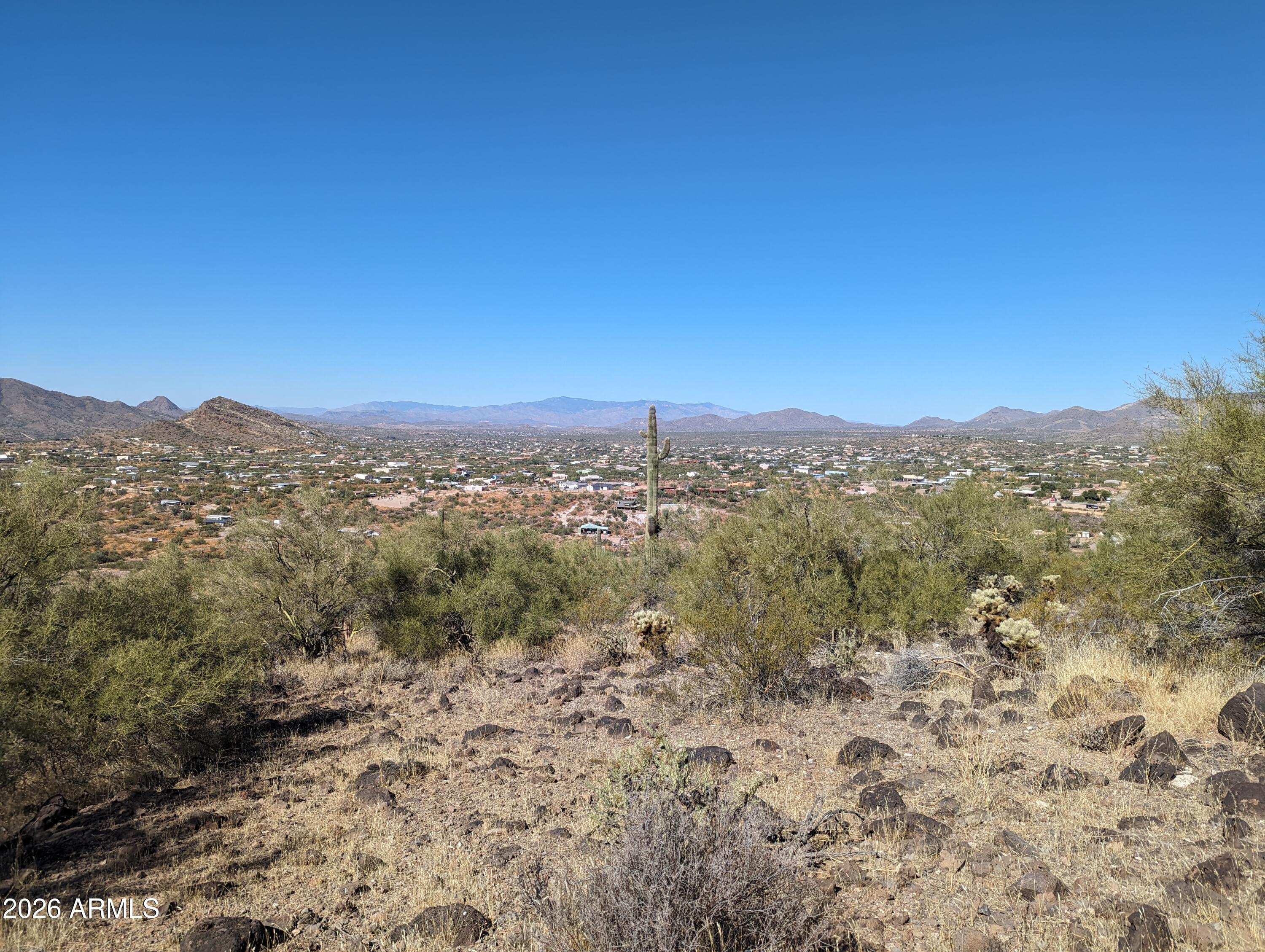 What if home wasn't just where you live--but where you could escape the city without leaving convenience behind? Nestled at the base of Apache Peak in one of New River's most desirable custom home areas, this beautiful 2.5-acre parcel offers an exceptional setting for your custom home, horse property, or peaceful retreat. Enjoy the peace, privacy, and spectacular desert scenery while maintaining convenient access to I-17, Cave Creek, Anthem's shopping, restaurants, schools, and everyday amenities. Available individually, or purchase the adjoining 2.5-acre parcel to create a rare 5-acre private estate. Agent Owned.