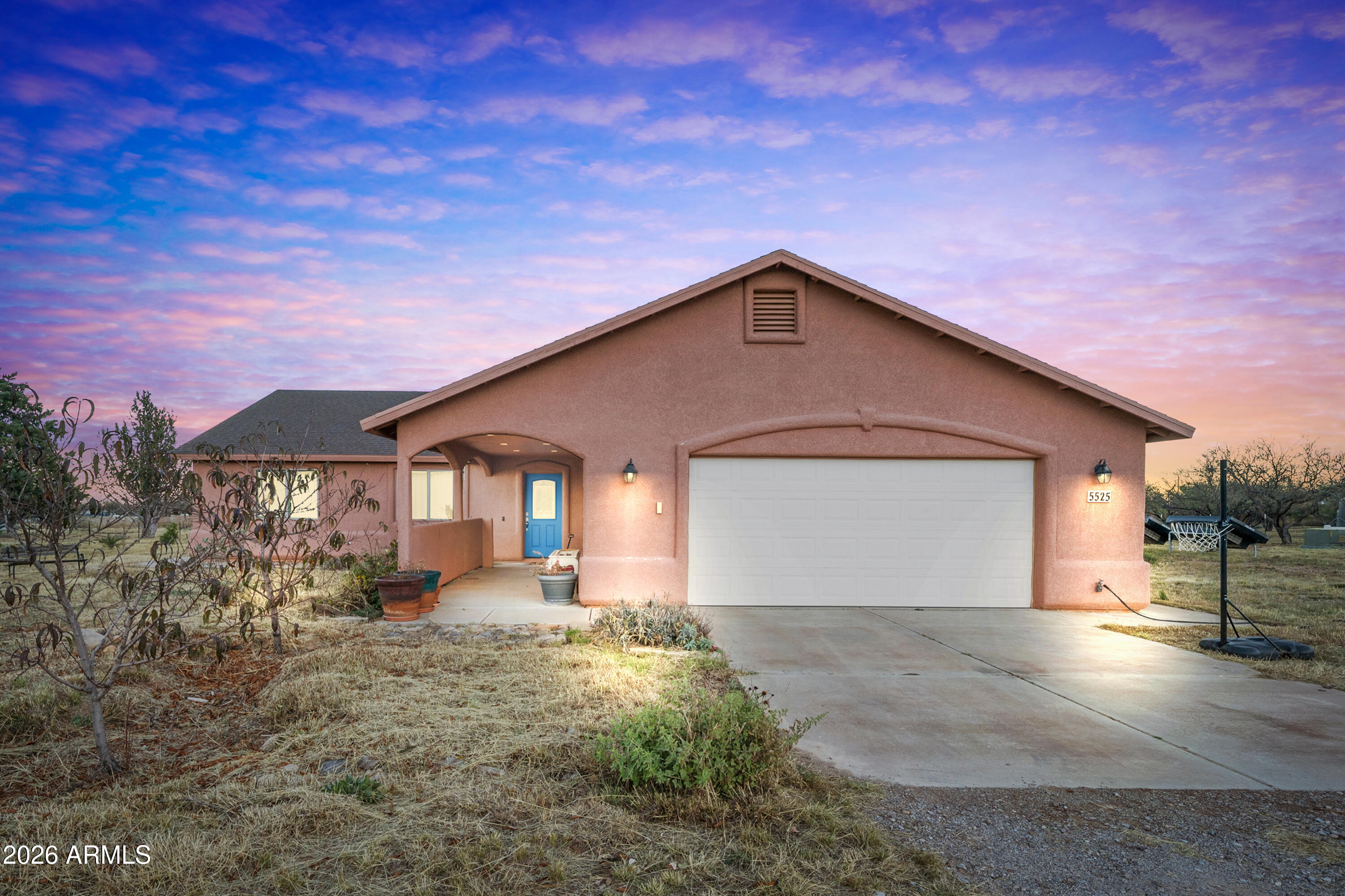 Set on a full acre, this custom home blends spacious living with a rare, established orchard and garden retreat. The desirable split floor plan offers 3 bedrooms, 2 baths, a 2.5-car garage, and central A/C. An oversized great room provides the perfect space for entertaining, complemented by upgraded ceramic tile flooring throughout and an open kitchen with abundant cabinetry. Kitchen features 2 source global hydropanels. 

The large primary suite features a custom bath with a Jacuzzi garden tub. A generous laundry room is included, and the washer and dryer will convey. Conveniently located just 10 minutes from Fort Huachuca, shopping, dining, and the mall. The property is a gardener's dream, boasting an exceptional variety of established trees and plants. Edible plantings include Fuji apple, Asian pear, Comice pear, almond, peach, plum, pomegranate, jujube, raspberry, grape, mulberry, rosehips, pineapple guava, nectarine, quince, pecan, and olive trees. Ornamental and pollinator-friendly plantings include desert willows, wisteria, roses, black locust, and forsythia. Native vegetation includes walnut, ash, sycamore, mesquite, palo verde, soapberry, hackberry, sumac, ocotillo, agave, honeysuckle, elderberry, and milkweed.