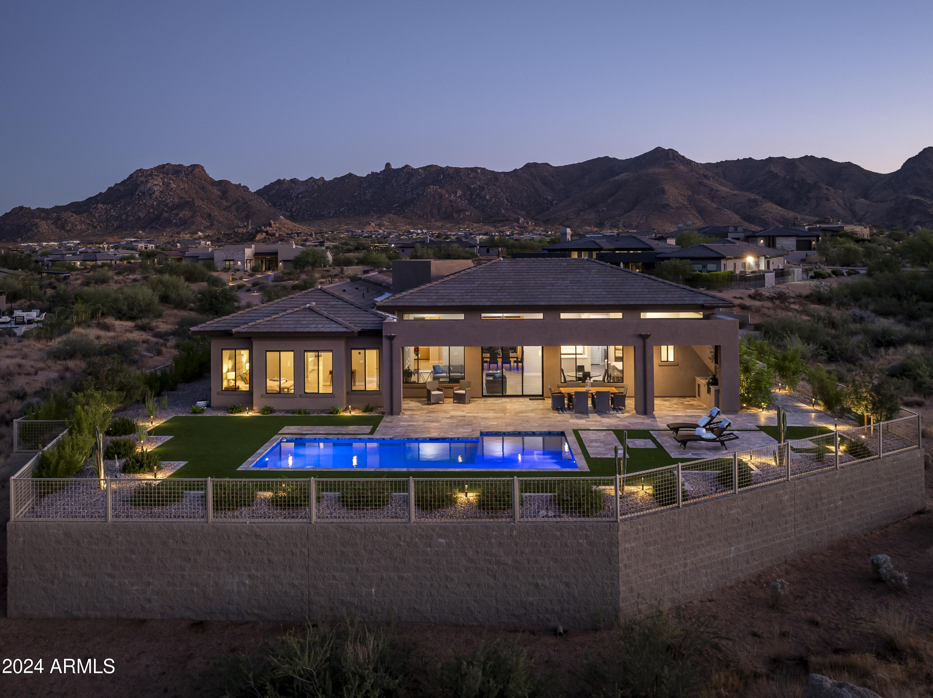 Discover your dream home in the prestigious Troon North, renowned for its exceptional desert golf experience. This stunning newly built residence boasts 3,939 sqft of sophisticated living space on a sprawling 1.68-acre cul-de-sac lot. 
Step inside to find an expansive open floor plan featuring a great room setup, ideal for modern living and entertaining. The layout includes 3 bedrooms with on-suite luxurious bathrooms, with upgraded tile flooring and exquisite cabinetry. The chef's kitchen is a culinary haven, equipped with a Wolf stove, a Subzero fridge and a butler's pantry with a bar counter right next to the dining room perfect for creating gourmet meals while enjoying the company of family and friends. The master suite is a true sanctuary, featuring a custom closet and an a master bathroom that has been thoughtfully designed with a separate tub and walk-in shower. Additional features include a bonus room that could also be used as a bedroom, with at attached den.
Enjoy the practicality of an oversized garage with epoxy flooring, added garage closets, and a convenient drop zone. The professionally landscaped backyard is a private oasis, complete with a sparkling swimming pool, BBQ area, and extensive hardscape for entertaining.