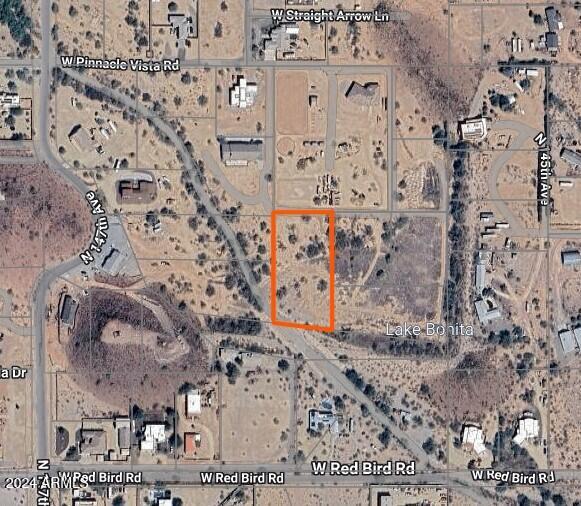 This 1.63 acre parcel is one of the best priced in the area! And the sellers will sell the 1+ acre lot next door also! Come check out this County Island special!. Low property taxes and no HOA.   New shared well recently installed.  The well, recent survey, and power nearby—all big value adds that save you time and money. There is floodplain but check with Maricopa County to see that it is buildable. Do your homework to see if it's right for you. A new Fry's Marketplace and other new shops, eateries and gas stations are less than 5 miles away. Yet, very little traffic in this area- Have your rural lifestyle with all the best conveniences! Come see it today!