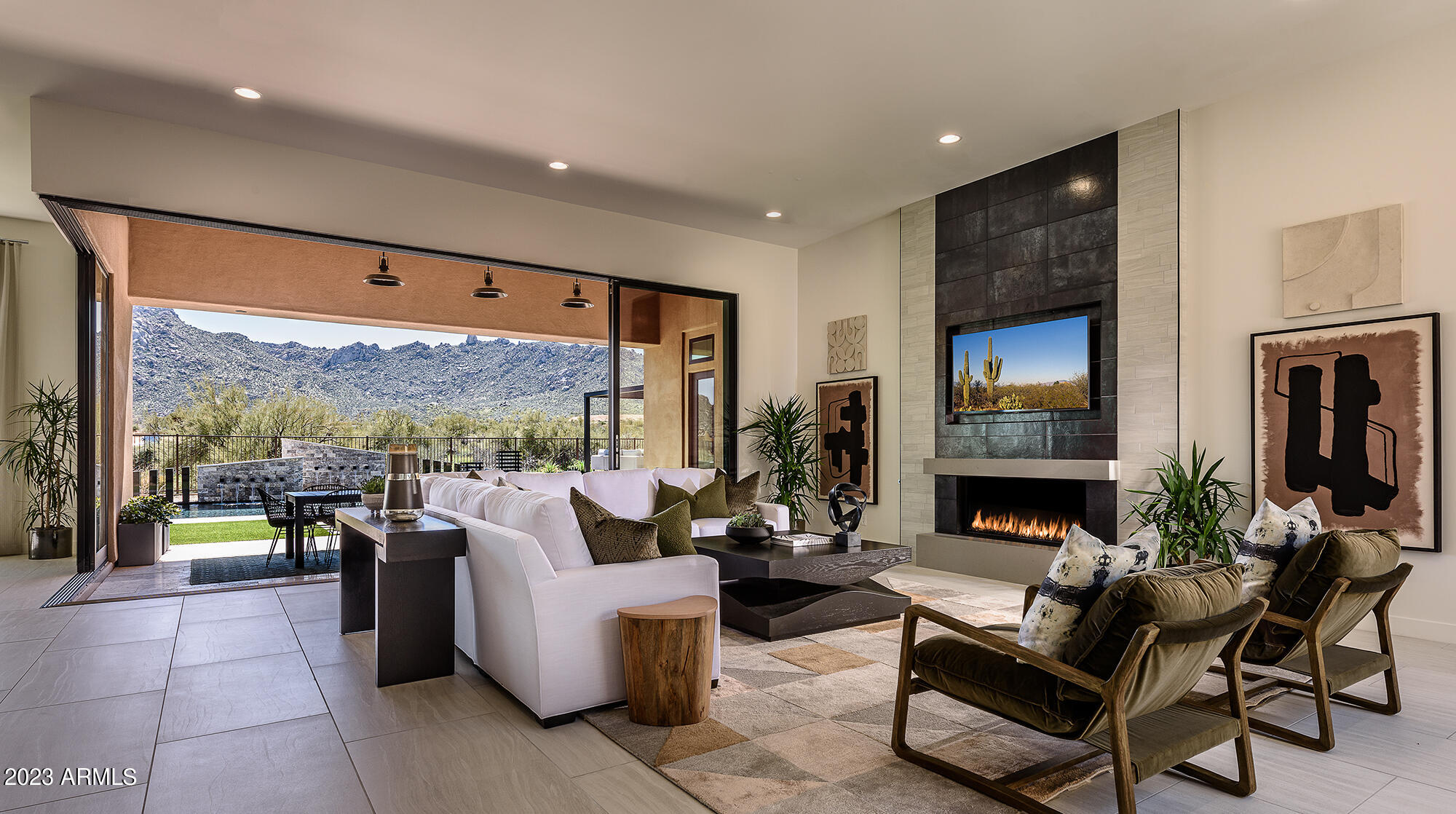 Remarkable ''Modern'' model home now available for sale-leaseback in gated Rosewood Highlands at Storyrock w/ seamless indoor/outdoor
living w/ Interior Courtyard, two 10-ft tall Disappearing Walls of Glass & dramatic 90-degree 10-ft tall Corner Wall of Glass at Great Room. Large lot w/ stunning
views of McDowell Mountains, Tom's Thumb & Four Peaks in Scottsdale plus landscaping w/ modern pergola, stone fireplace & unique Pool. Numerous custom features throughout from this award-winning Interior Design w/two modern Ortal fireplaces, ceiling beams, extensive built-ins, expansive Andersen View Windows, wonderful Master Suite, large ensuite Bedrooms, Den plus impressive Kitchen w/waterfall island, custom cabinetry, rare countertops, Wolf Appliances, 72'' Sub-Zero Ref/Freezer & more.