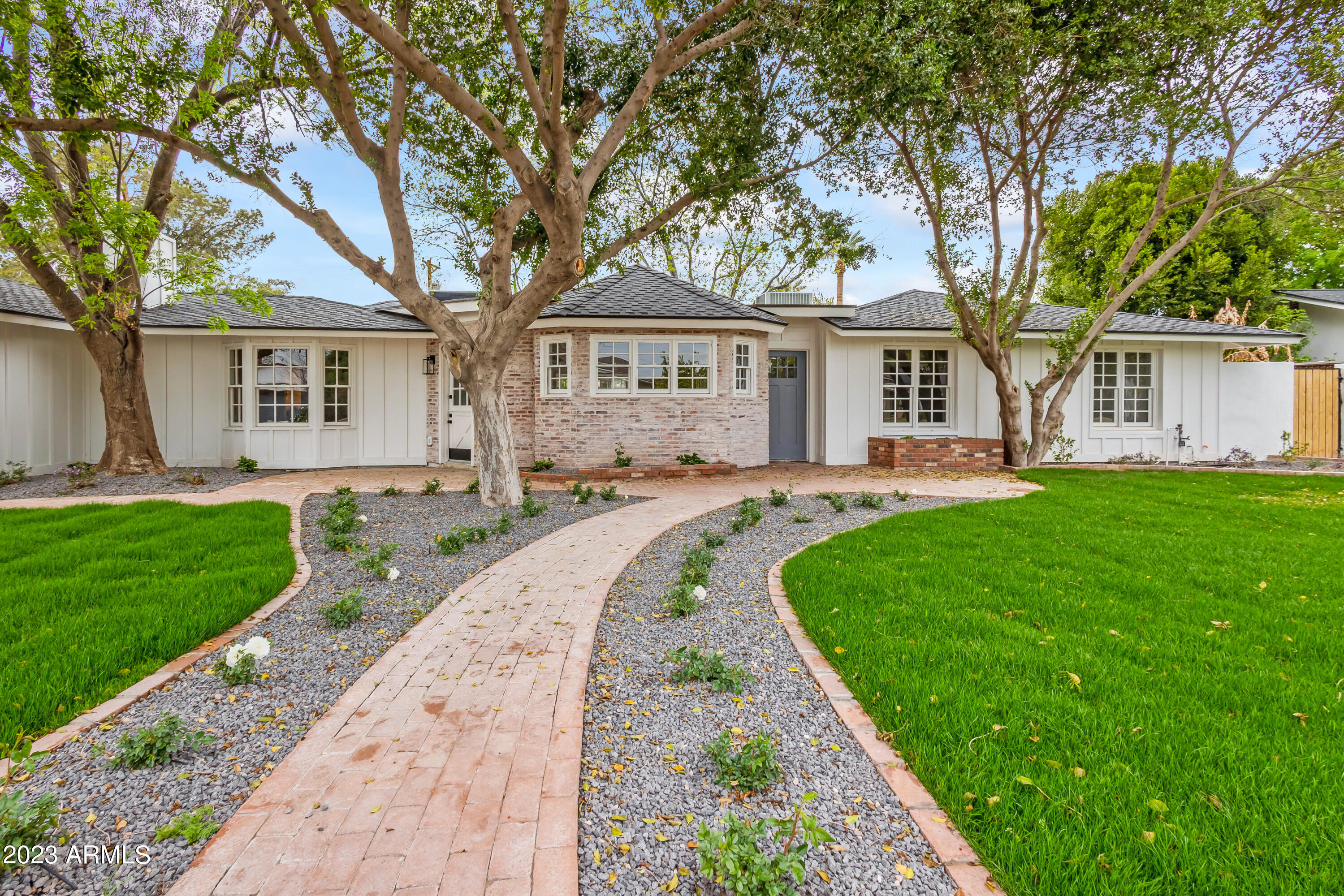 Quintessential Arcadia Proper Charmer on very updated street. Fully renovated with new large master on one side, complete with lofted ceiling and large walk in closet, prior master and two other generous en-suites on opposing wing. Large chef's kitchen with separate dining room and family room, wood burning brick fireplace, dutch door rambling into beautiful front yard. New landscaping and backyard perfect for entertaining with pebble tech pool.  Prime location to beach bike bike to and from all the best shops, restaurants and amenities that both Arcadia and the Water Front at Old Town Scottsdale have to offer.