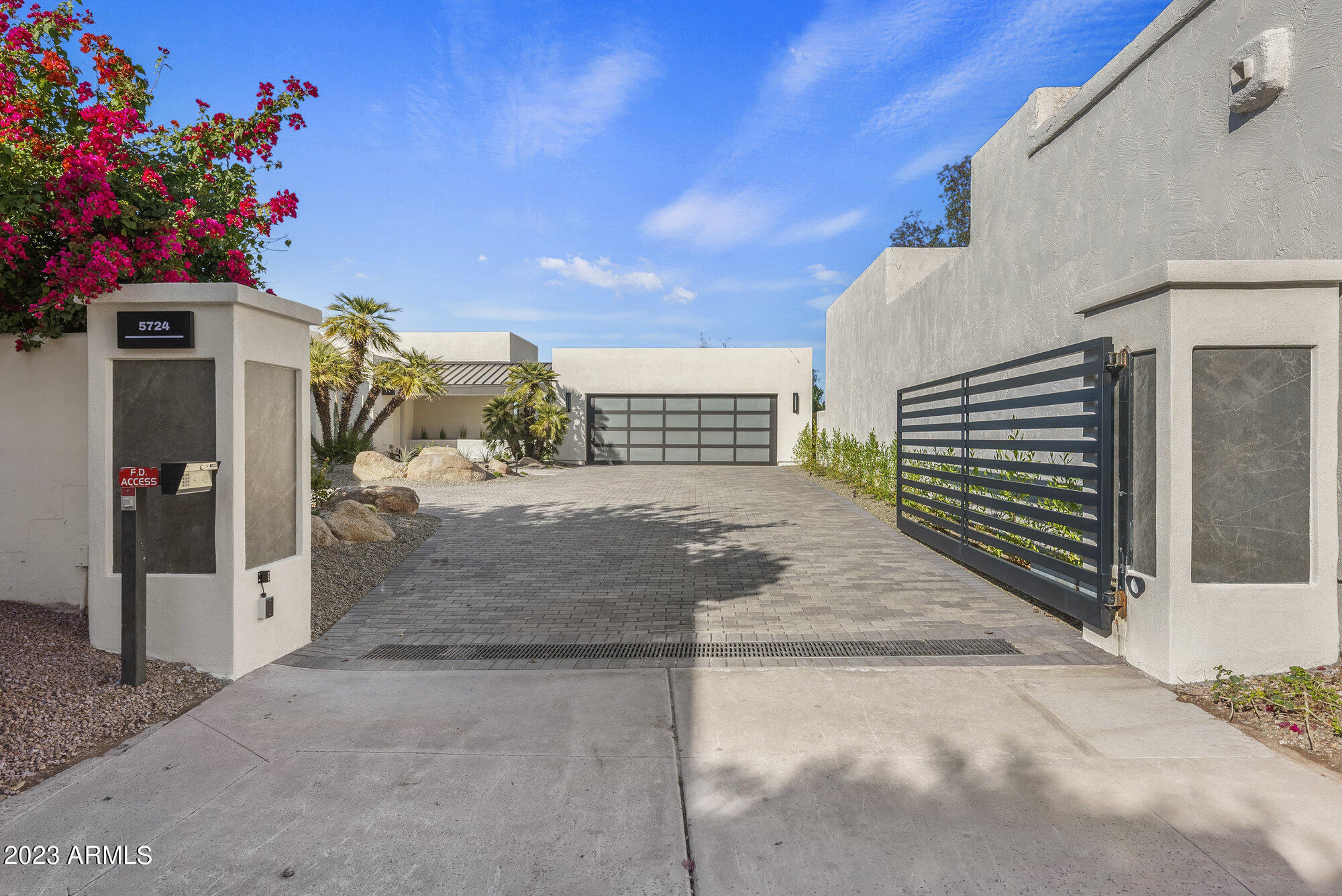 Echo Canyon, with its rich history, is nestled against the World renowned Camelback Mountain. This home was done by Bedbrock Development with it's contemporary design and magnificent views from every room, including the Praying Monk, Mummy Mountain,  Phoenix Mountains, all the way to the White Tanks. This 3 bed, 3.5 bath has12' plus ceiling has been taken down to the studs. Every inch both inside and out has been updated. 32feet of 10' stacking doors frame Piestewa Peak and surrounding Mountains. This is the only privately gated home in all of Echo Canyon with one of, if not the most secluded lots int the community.  Hook up for electric vehicle.  Bring your Client, they will not be disappointed.