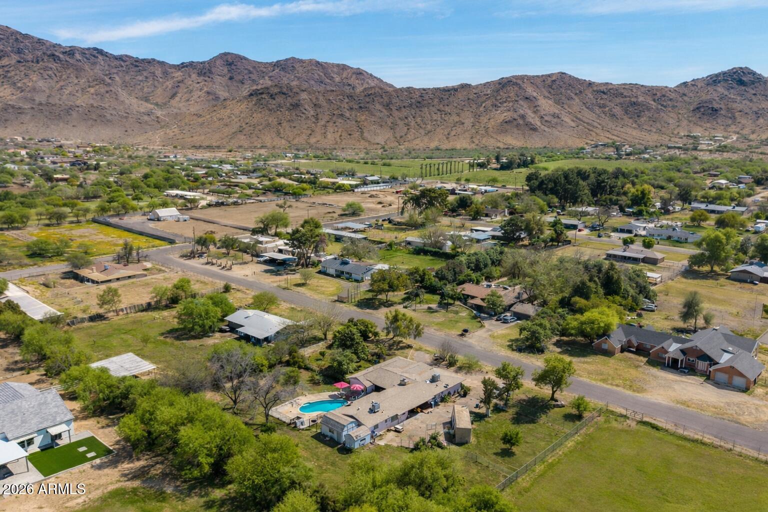 Amazing farm and acreage opportunity. 3 bed main home with a 2 bed/ 1 bath guest house near South Mountain! The main home features oversized bedrooms, modern finishes, fireplace, updated flooring, and recessed lighting . New A/C installed in 2022 and 2023 for comfort and efficiency.
The fully irrigated property includes mature fruit trees. Additional features include a large workshop, carport, pool, hot tub, and 3 washer dryer hookups.
Both homes offer a modern look and feel, with landscaped front and back yards. Guest house currently tenant occupied, offering an extra income opportunity.
A spacious and versatile property with room for guests, hobbies, and outdoor living, shipping container negotiable  must-see near South Mountain Matterhorn 3d tour available on Homes.