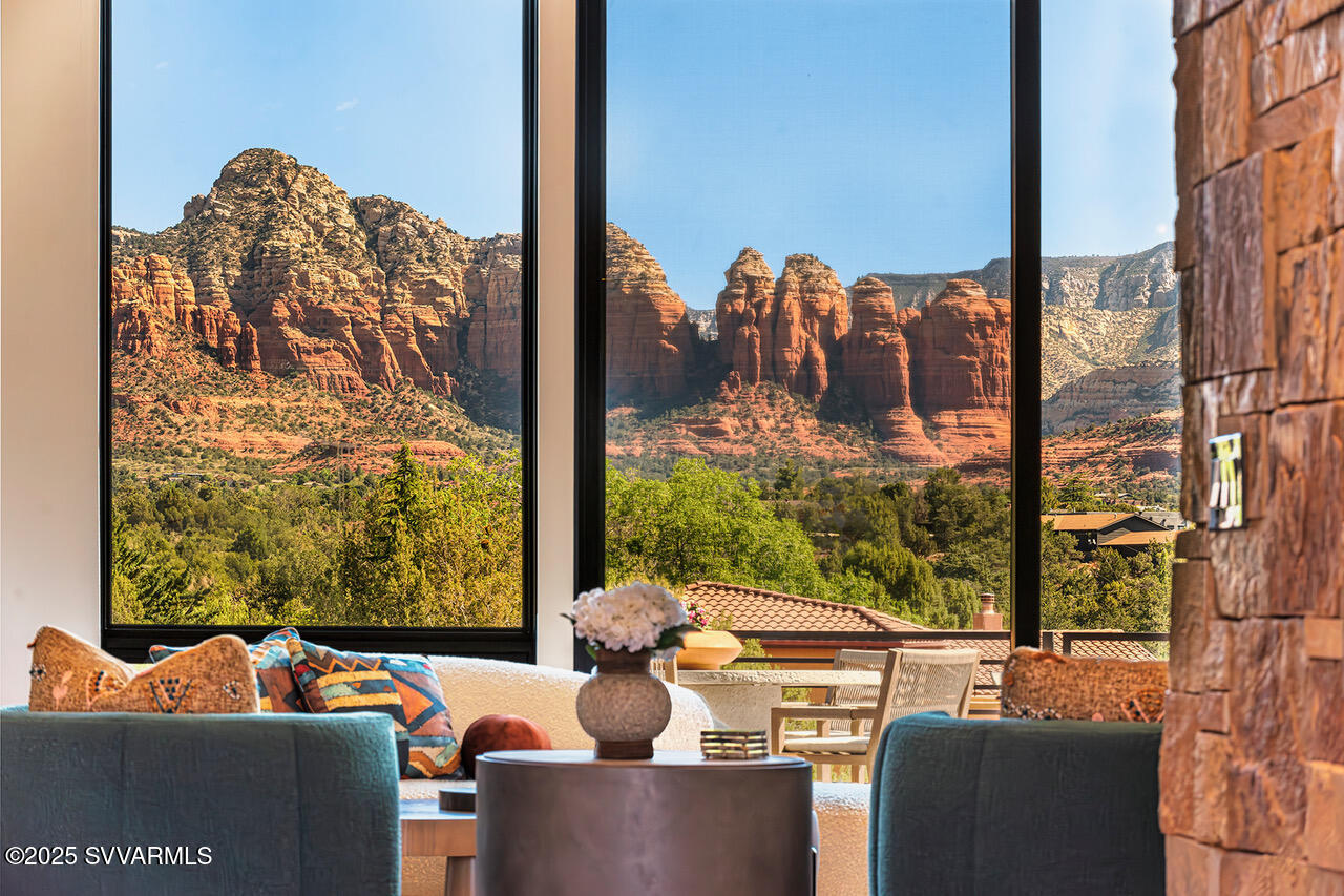 HUGE PANORAMIC RED ROCK VIEWS!  This 4 bedroom, 4 bath home is 1 on one level with 3 car garage including a heated/cooled  RV bay.  Located near national forest with end of road privacy this home sits on 1.33 acre.  It boasts an incredible outdoor living space that blends into the natural landscape and a rare wildfire protection system.   Close to hiking trails and all the conveniences of West Sedona.The appx 3500 of interior space has been masterfully designed by well-known Palm Springs designer Christorpher Kennedy.  Artistically modern aesthetic that skillfully blends natural elements to a luxury environment. Built in 2024 this home is still under a builders warranty.