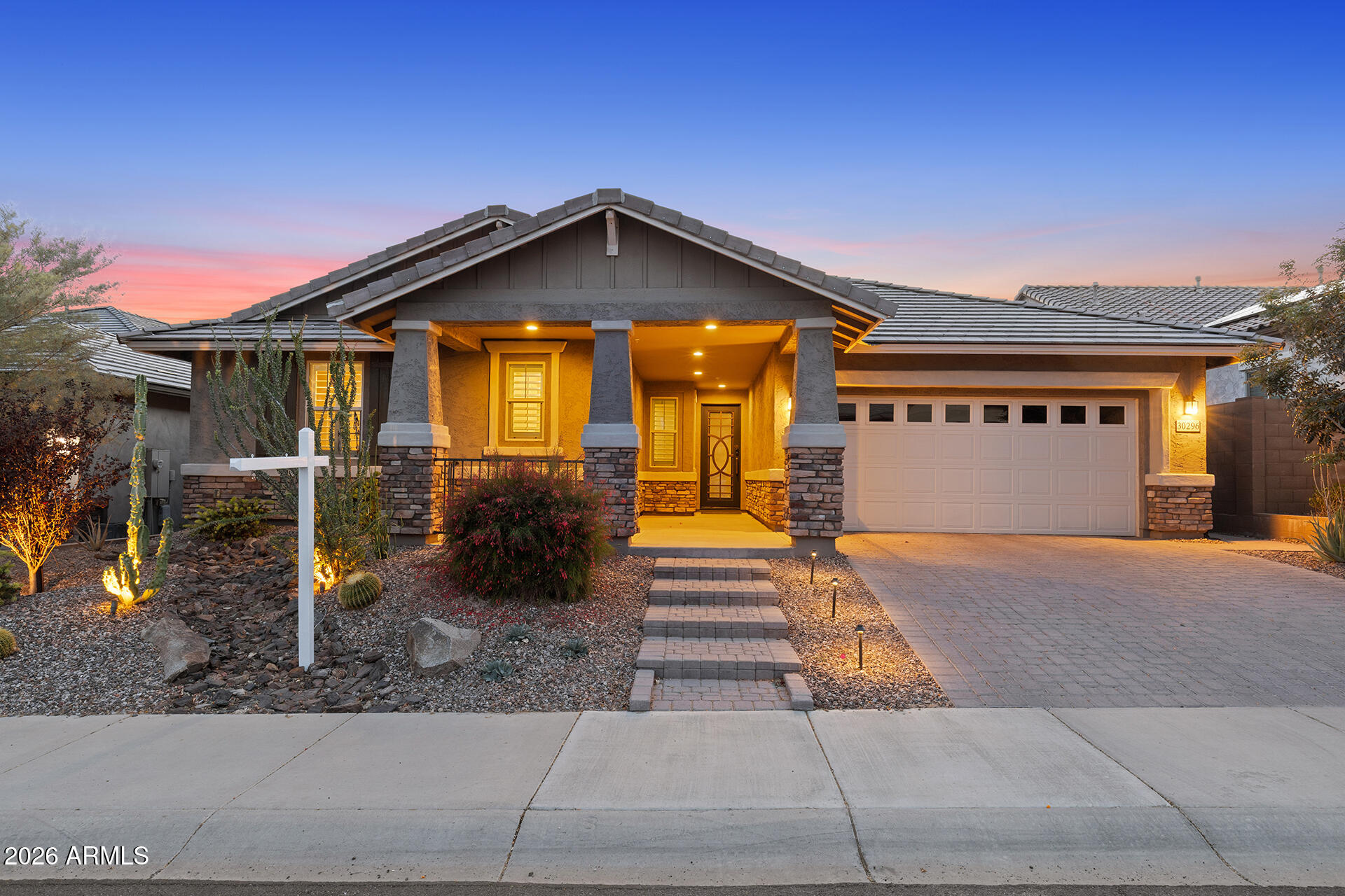 Elegant curb appeal and a backyard retreat make this 4 bed / 3 bath home a true gem! Offering 2,510 sq/ft of spacious living, this home features a paver step walkway + brick accents on the pillars out front and sleek wood-look plank flooring inside. The kitchen is a dream with abundant white cabinetry, upgraded countertops + a large island, and a walk-in pantry.  The oversized primary suite offers a walk-in closet and a luxurious full bath for the perfect private retreat. Step outside to an entertainer's paradise with lush landscaping, artificial grass, pavers, a built-in BBQ, and a large sparkling pool - creating the ultimate outdoor oasis. This home combines style, comfort, and resort-style living!