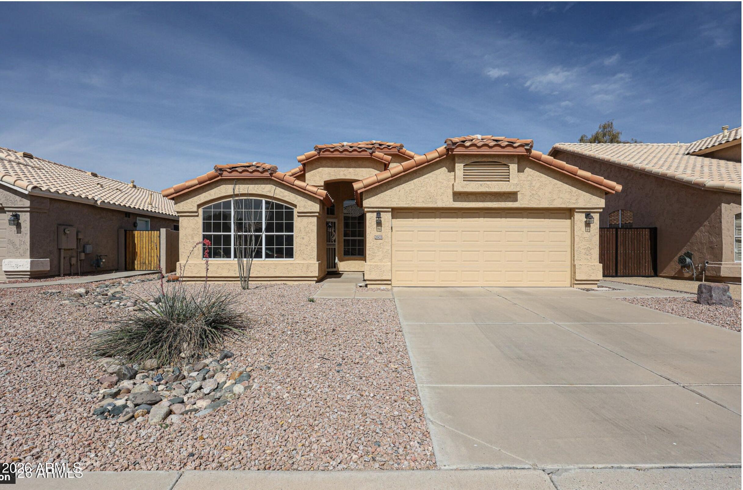 Enjoy easy living in this well-maintained 4-bedroom, 2-bath home in the highly sought-after Peoria School District. With nearly 2,000 sq ft, this home offers spacious living and a functional layout. Relax in the open living/dining area or cozy up in the family room with vaulted ceilings and a gas fireplace. The kitchen features a center island, ample counter space, and pull-out cabinetry. The primary suite includes a private bath with separate tub and shower and access to a quiet backyard patio backing to a greenbelt. Updated with newer roof, HVAC, exterior paint, flooring, carpet, and fixtures. Close to parks and outdoor space--perfect for comfortable everyday living.