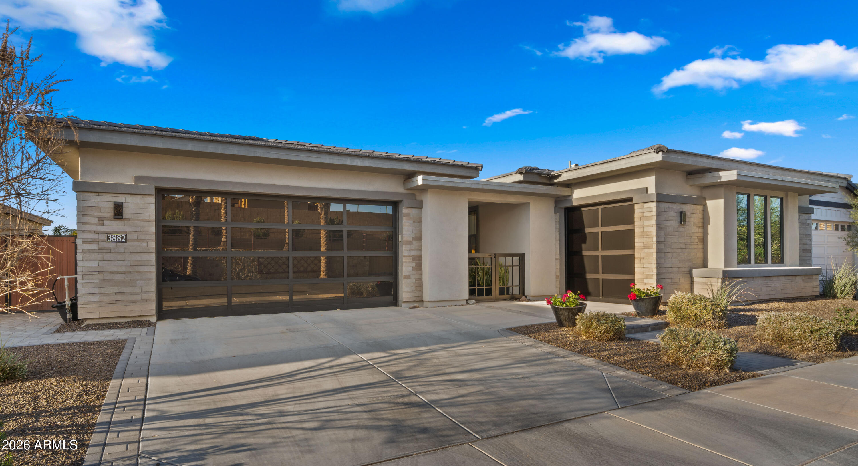 Experience upscale living in this fully upgraded Toll Brothers residence: 4 bedrooms, 3.5 baths in the gated Legacy community of Seville Golf & Country Club. Soaring 10-foot ceilings and luxury plank tile create an elegant, low-maintenance interior. The gourmet kitchen--complete with KitchenAid appliances, custom cabinetry, and granite countertops--flows to the great room and outdoor entertaining area through two 8' multi-stacking glass pocket doors for effortless indoor-outdoor living. The spacious primary suite also features glass doors for direct access to the backyard.

The resort-style yard is an entertainer's dream: sparkling pool, extended travertine patio, pergola with built-in BBQ and stainless flat grill, and an elegant entertainment wall--perfect for sunset evenings and watching the game. North-south exposure maximizes comfort and light. A short walk or golf-cart ride leads to the Country Club's private entrance; membership (separate from HOA) offers dining, fitness, pickleball, tennis, basketball, pools, waterslides and more. This home isn't just a residence--it's a lifestyle.