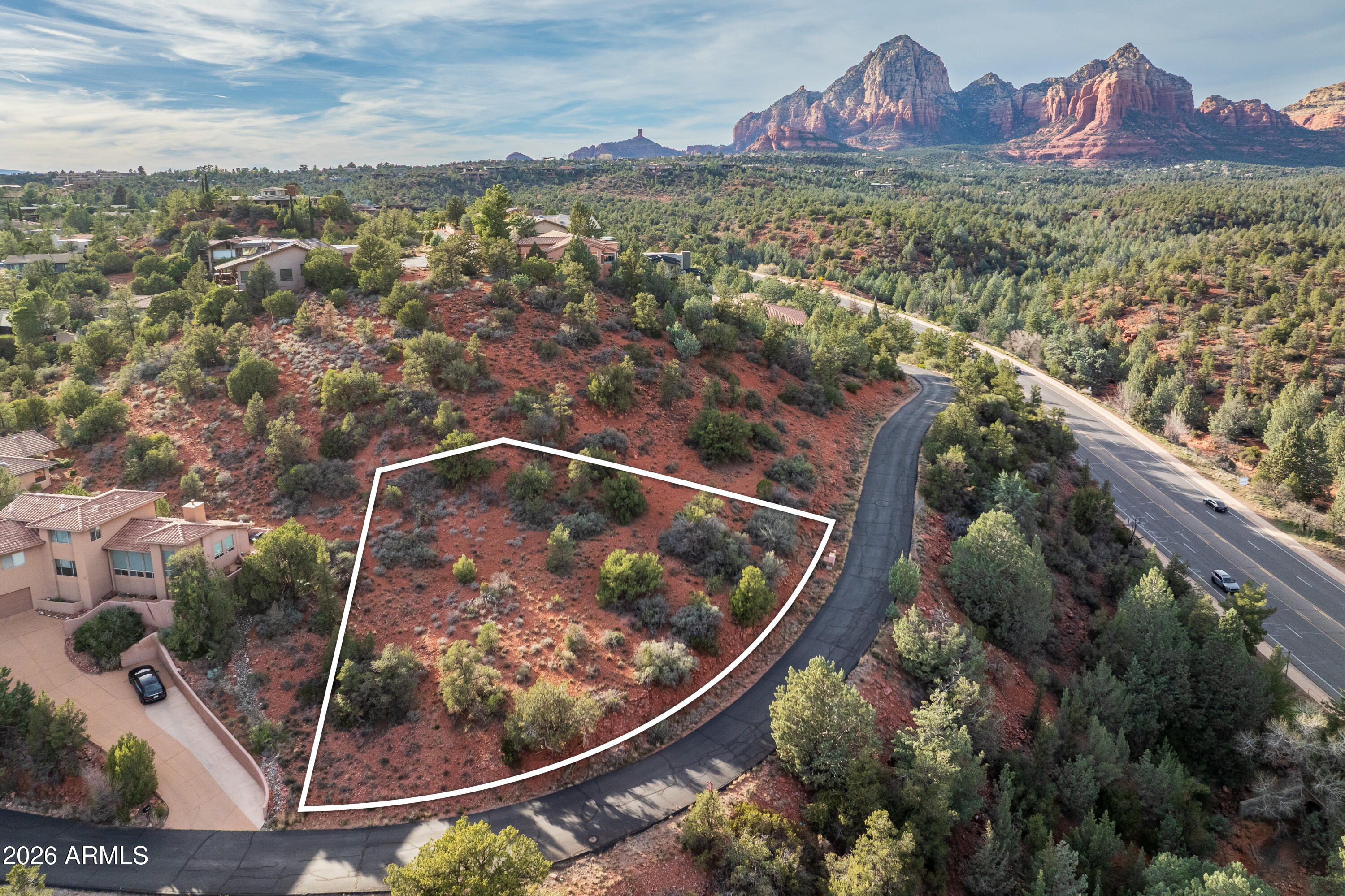 VIEWS, VIEWS, VIEWS. Stunning elevated hillside lot in the highly sought-after Rolling Hills Estates in West Sedona, offering breathtaking panoramic views of the iconic Red Rocks. Survey available. This beautiful property sits high above surrounding homes, providing exceptional wide-open vistas and an ideal setting for a custom luxury residence. No timeline to build, allowing you to purchase now and build at your convenience. Low annual HOA dues. Within approximately 250 yards of the National Forest trail system and within walking distance to nearby restaurants, grocery stores and shops. An incredible opportunity to secure a premium view lot in a prime Sedona location. Two lots (82/83) available: (Lot 83) 210 Barcelona is offered at $225,000. (Lot 82) 230 Barcelona is offered at $195,000.