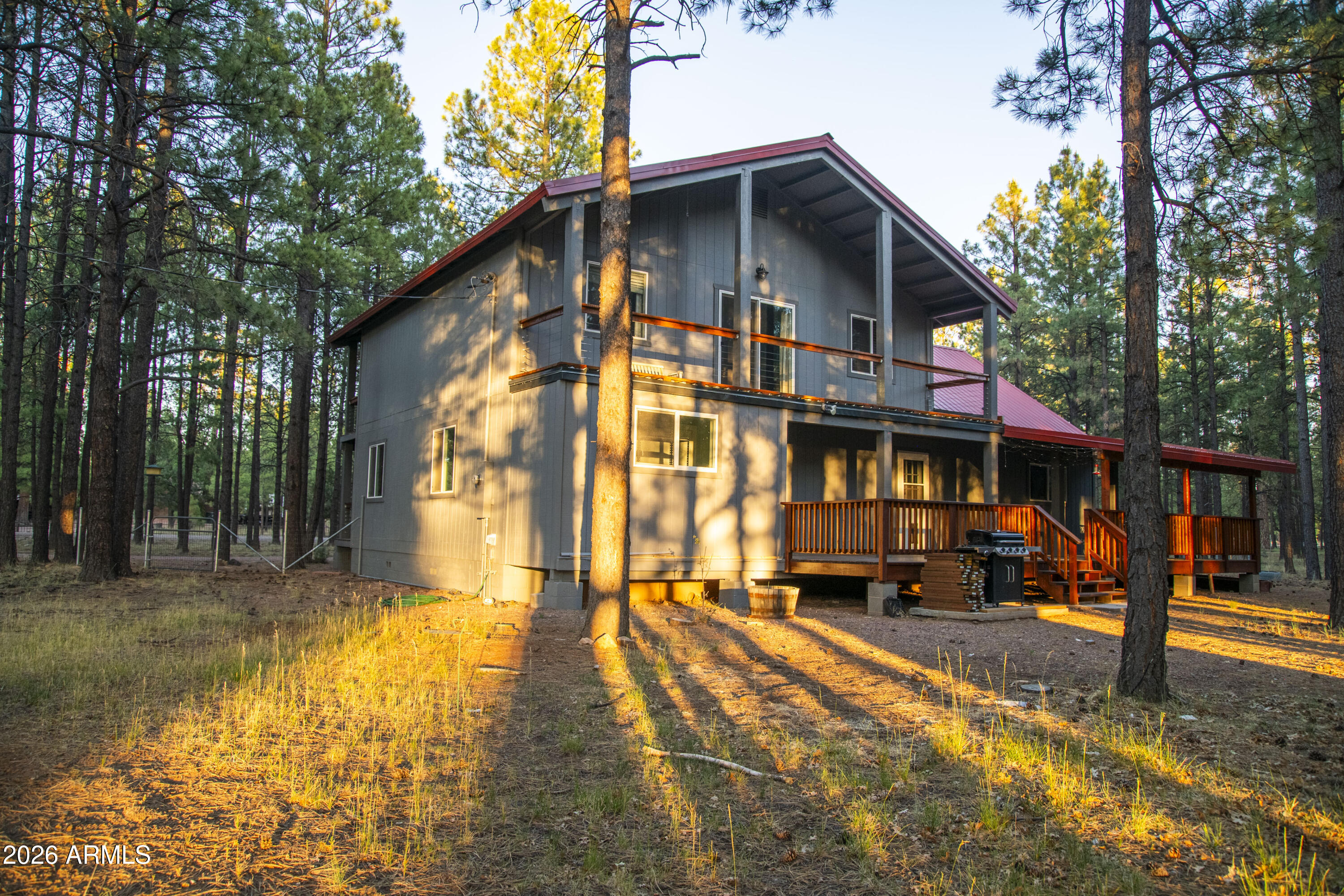 Escape to the cool pines of Happy Jack with this charming 4-bedroom, 2.5-bath cabin situated on 1.57 usable acres in a peaceful, non-HOA community. Nestled on a desirable corner lot and almost entirely fenced, this property offers the perfect blend of privacy, functionality, and mountain living.
Inside, you'll find a warm and inviting cabin with plenty of space for full-time living, a weekend retreat, or a vacation rental. The spacious floor plan features four bedrooms, two and a half bathrooms, and comfortable gathering spaces designed for relaxing after a day of exploring Arizona's high country.
Outside is where this property truly shines. A detached 3-car garage provides ample room for vehicles, recreational toys, tools, or a workshop, while two additional powered outbuildings offer endless possibilities for storage, hobbies, home offices, or creative workspaces. With over 1.5 acres of land, there's plenty of room for RV parking, trailers, outdoor entertaining, gardening, or simply enjoying the peaceful forest surroundings.
Located in the sought-after community of Happy Jack, you'll enjoy cool summer temperatures, abundant wildlife, and easy access to hiking, fishing, off-road trails, and endless outdoor recreation. Whether you're looking for a year-round residence, a family getaway, or an investment opportunity, this versatile mountain property delivers the space, flexibility, and lifestyle you've been searching for.