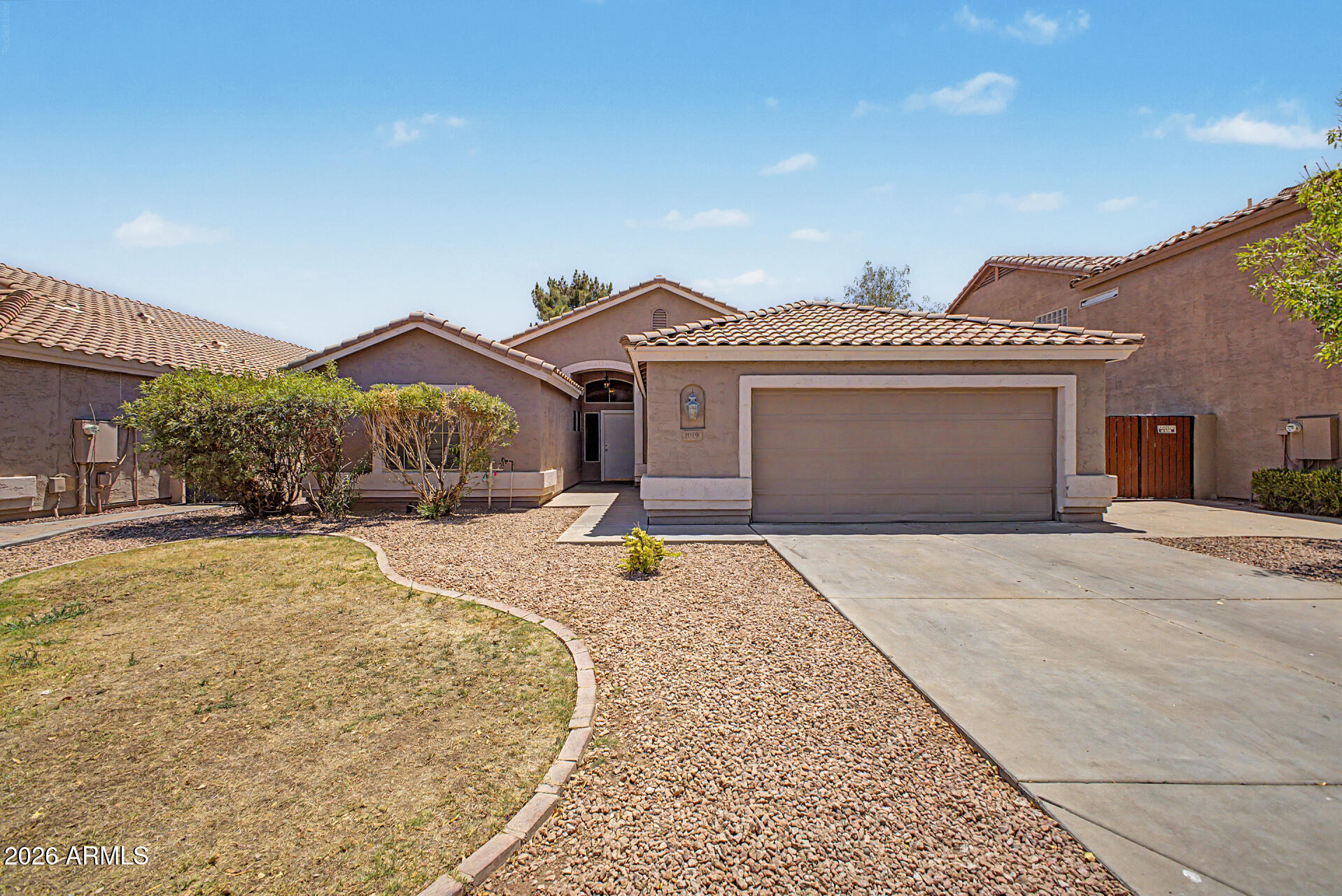 Welcome to the highly desirable Lindsey Ranch! This wonderful single-level home is nestled in the heart of Gilbert and is truly move-in ready. Step into your own backyard oasis featuring a sparkling pool, perfect for entertaining and enjoying Arizona living at its finest. Inside, you'll find a beautiful and spacious floor plan with 4 bedrooms (or 3 bedrooms plus a den/office), ideal for working from home or flexible living needs. The fantastic kitchen opens to a spacious great room, creating the perfect gathering space for family and friends. Vaulted ceilings and ceiling fans throughout add to the home's open and airy feel. The large primary suite offers a walk-in closet and an ensuite bath complete with dual vanities, a separate shower, and a relaxing garden tub. Located within highly rated Gilbert schools and just minutes from restaurants, movie theaters, shopping, and more, this home offers the perfect blend of comfort, convenience, and lifestyle!