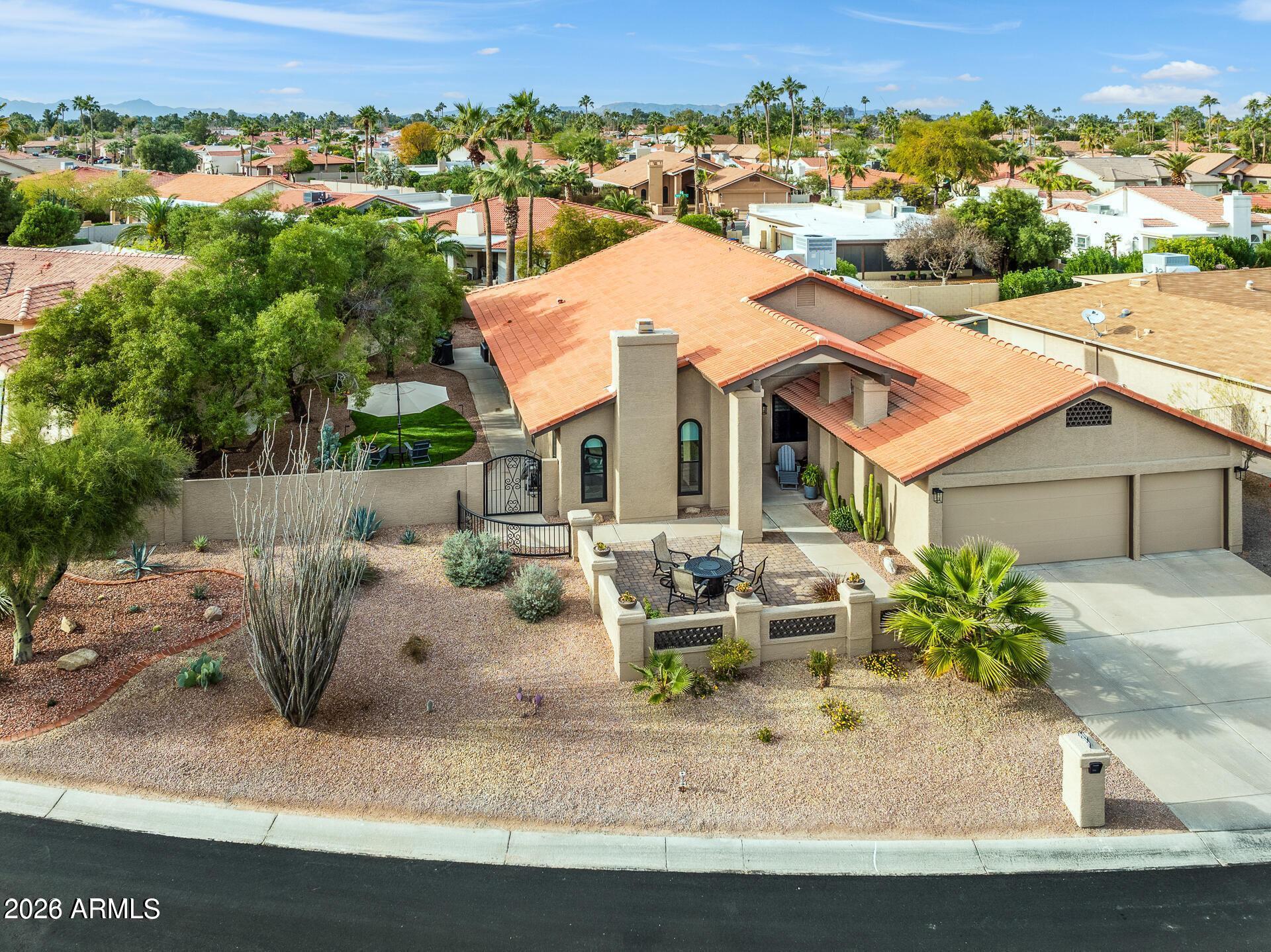 Beautifully renovated POSADA model offers the turn-key lifestyle buyers want. A private, PAVERED courtyard & double-door entry opens to vaulted ceilings, wood-look tile flooring & a cozy  fireplace. The updated kitchen features newer cabinetry, QUARTZ countertops, STYLISH backsplash, STAINLESS appliances & range hood, PULL-OUT SHELVING & an ISLAND w/breakfast bar. Both baths have been remodeled, the primary bath w/PRIVATE toilet room, separate SOAKING TUB, spacious WALK-IN SHOWER + a HUGE closet. The den/office has BUILT-IN bookshelves & extra storage. NEWER black vinyl DUAL PANE Milgard windows & doors, a newer BOSCH 5 TON inverter package AC unit, FRESH PAINT inside/out, & an EPOXIED 3-car garage floor. GORGEOUS, private backyard & sideyard w/TURF, mature trees and LUSH vegetation