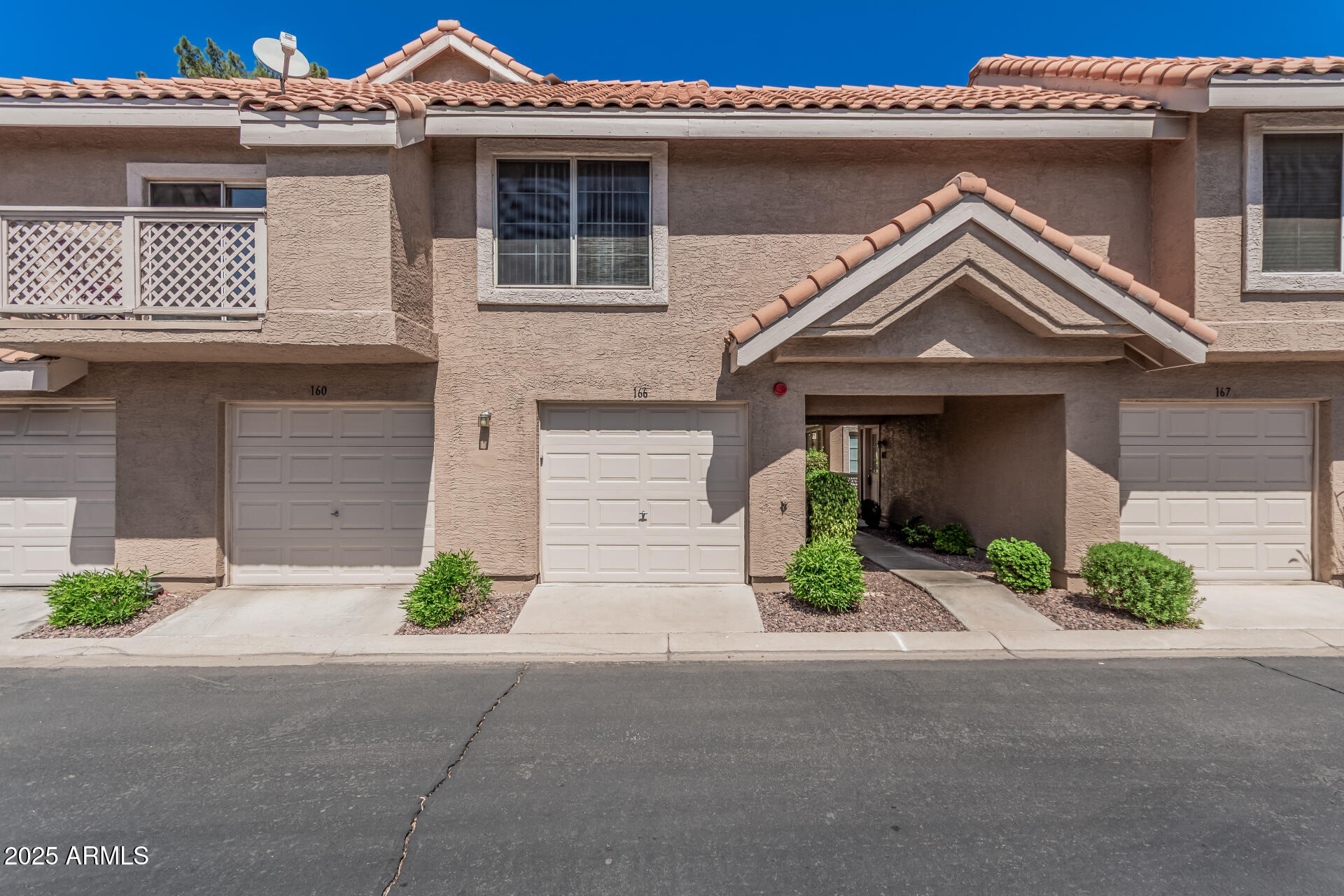 Welcome to this gorgeous 1 bedroom, 1 bathroom townhome with a 1 car garage located in the highly desirable Beach Club Village at Val Vista Lakes. Offered fully furnished at full price, excluding only the seller's personal items, this move in ready home is an incredible opportunity for a primary residence, winter retreat, or investment property. Perfectly situated near restaurants, shopping, schools, parks, and with easy access to the US 60 freeway, this home combines comfort, convenience, and resort style living. You'll love the open and airy layout featuring cathedral ceilings that enhance the natural light and spacious feel throughout the home. The kitchen offers ample cabinetry for storage and organization along with a functional layout ideal for everyday living. The spacious bedroom is filled with natural light and includes a walk in closet, vanity area, shower/tub combination, and direct access to your private balcony. Additional features include ceiling fans, a private patio area, storage room, front security door, and an attached one car garage. Beach Club Village residents enjoy access to their own private pool and hot tub, while Val Vista Lakes HOA membership provides an unmatched lifestyle experience with access to the clubhouse, racquetball court, sand volleyball court, 8 tennis and pickleball courts, Jr. Olympic size pool and spa, lagoon style pool, fitness center, and four scenic lakes for boating and kayaking. This desert oasis is truly a must see and an exceptional value.