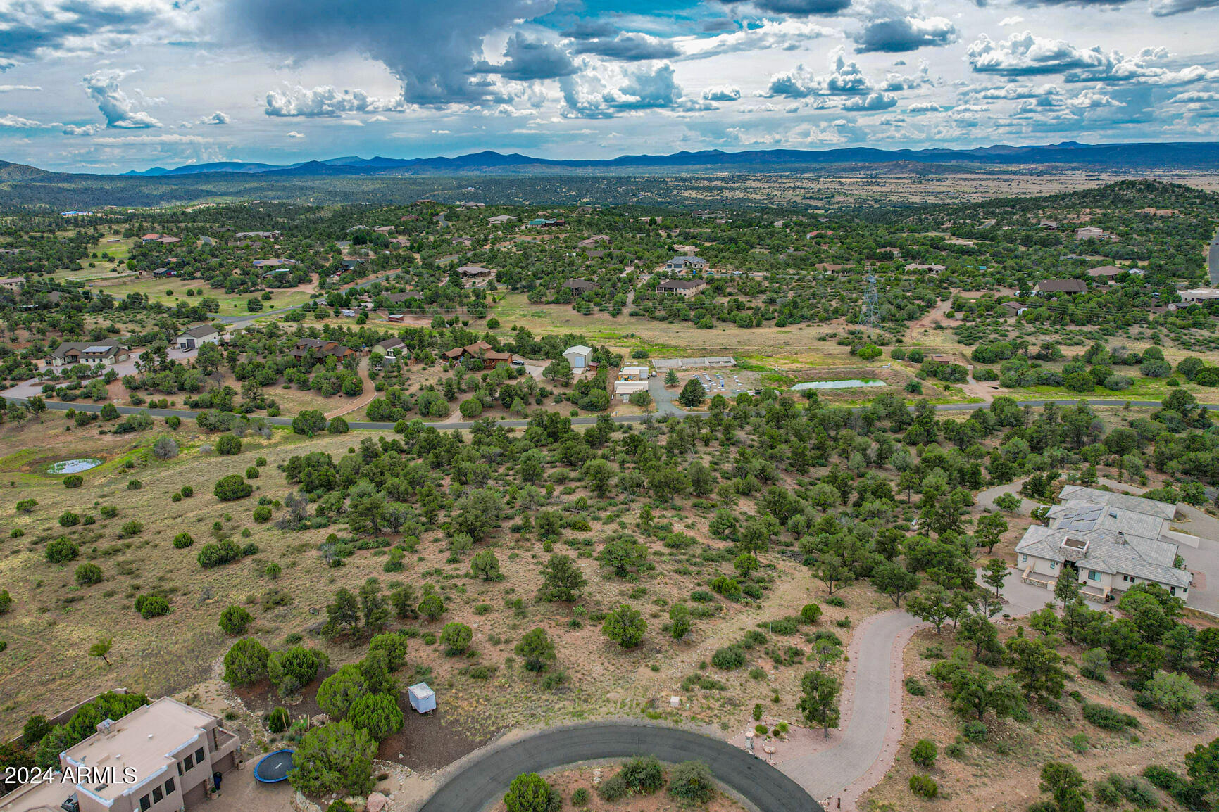 Located near the summit of one of the highest hills in desirable Inscription Canyon, this distinctive homesite offers a rare opportunity to build your custom dream home. One of the limited view lots in the community, the property provides elevated views along with privacy and natural beauty. Dual access from both the upper and lower roads offers flexibility for designing your ideal residence and workshop. Mature trees create a serene, partially wooded setting. Site-built homes only with an 1,800 sq ft minimum. Recently surveyed and ready for your vision.