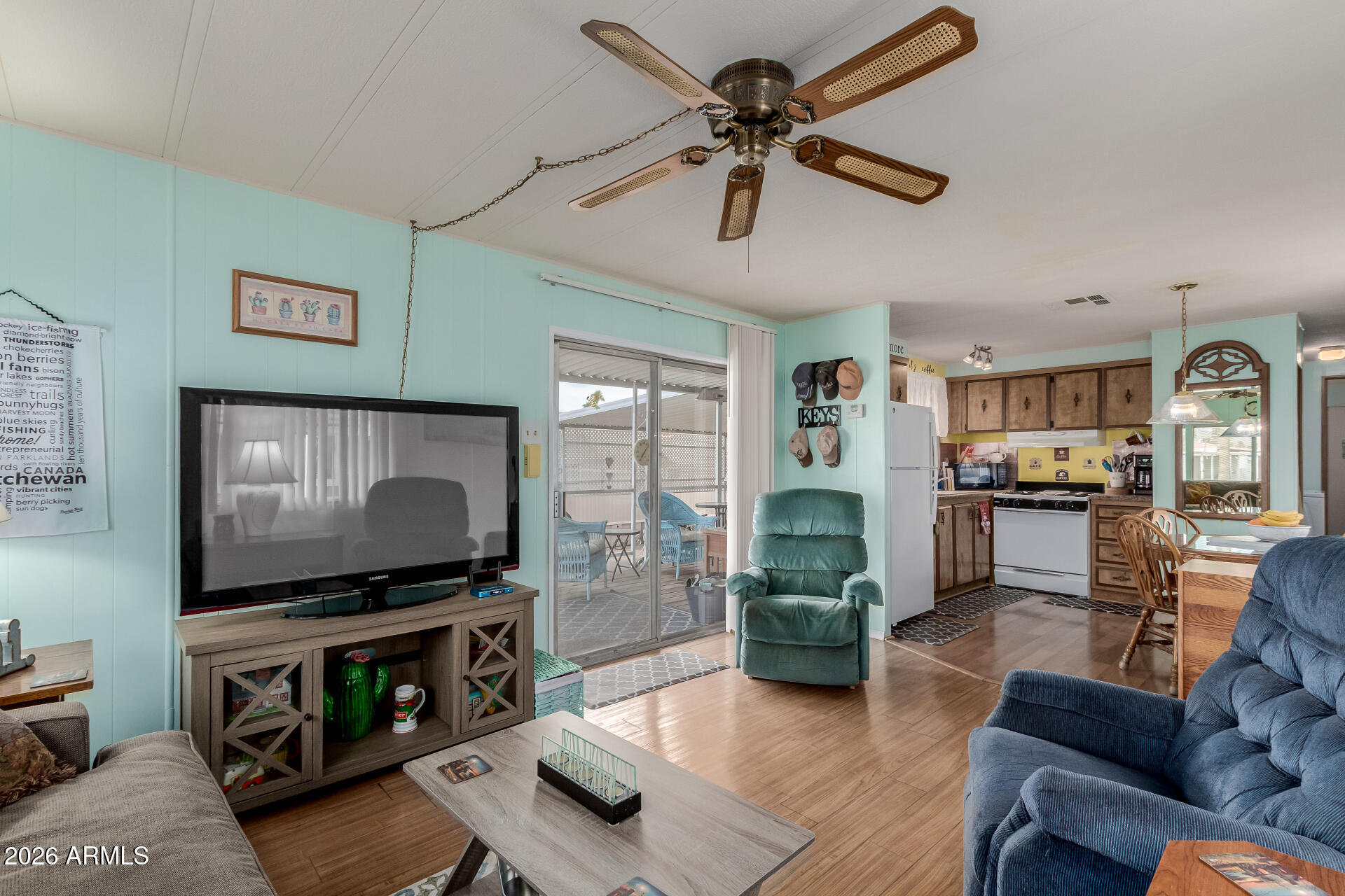Become the proud new owner of this 2-bedroom home in Apache Junction, AZ! Golf cart included** From the moment you arrive, you will immediately notice the carport parking, low-maintenance front yard, and a welcoming front porch to enjoy views & visiting friends from community. The inviting great room offers cozy living experience, featuring wood-looking floor, soothing palette, tons of natural light, and ceiling fans throughout for year-round comfort. The kitchen has track lighting, matching appliances, and ample cabinet space for easy organization. Each bedroom ensures a comfortable space for restful nights. For added convenience, this property includes a storage shed. Don't miss out!
