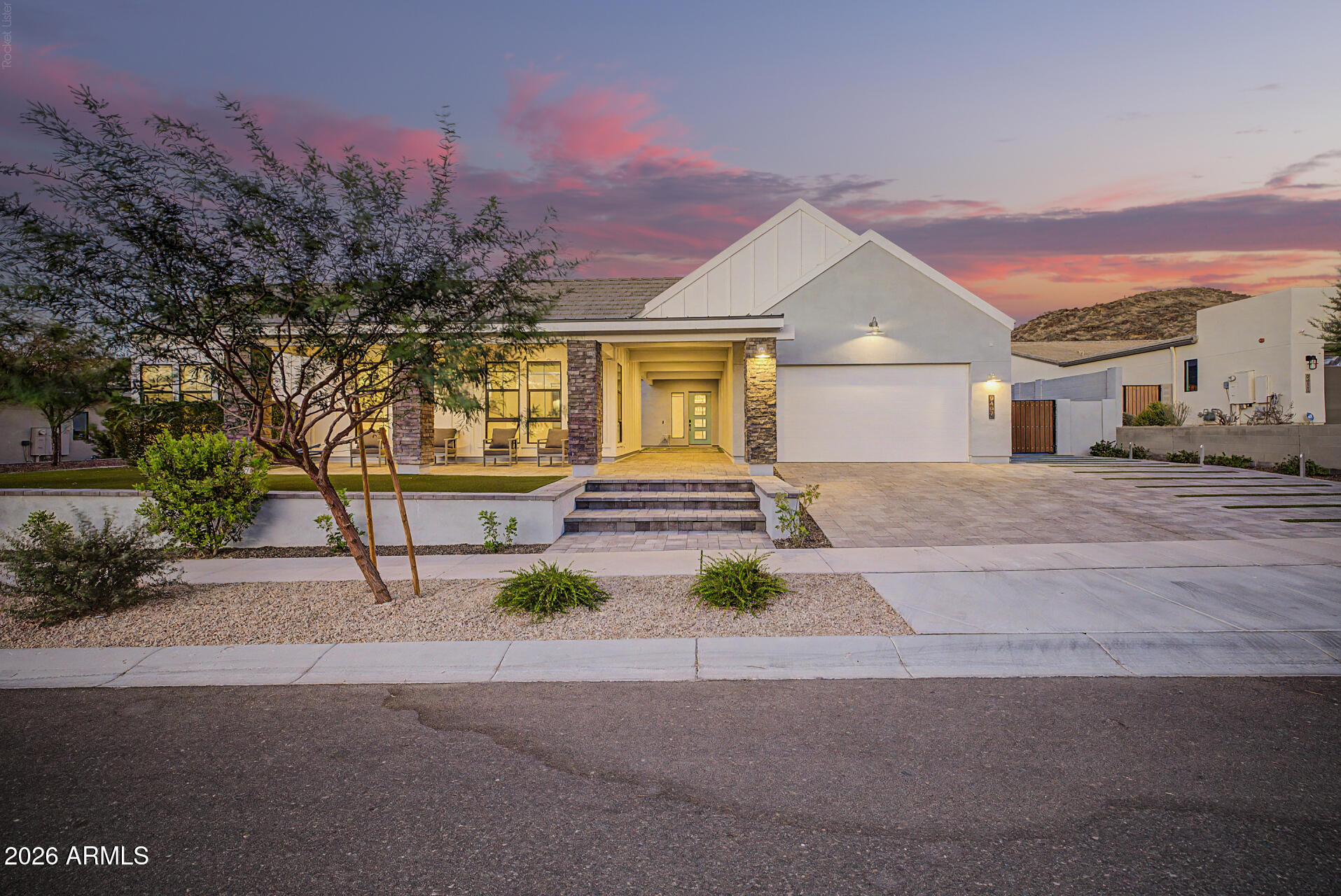 Experience elevated desert living in this exceptional 5-bedroom, 3.5-bath residence featuring the only Alta Plan II elevation of its kind. Spanning more than 4,769 square feet and over $500,00 in additional builder & after build upgrades this thoughtfully designed home showcases breathtaking mountain views, soaring cathedral ceilings with exposed beams, and seamless indoor-outdoor living through an impressive 18-foot pocket door.
The resort-style backyard is designed for both relaxation and entertaining, offering a private saltwater lap pool with Baja shelf, tranquil water features, mature palm trees, expansive travertine patios, lush turf, and over 90 feet of tempered-glass fencing that preserves both safety and spectacular views. At the heart of the home, the gourmet chef's kitchen is complemented by a butler's pantry, premium quartz and quartzite surfaces, Italian porcelain tile, and designer RH lighting throughout. Modern conveniences include a 4-car tandem garage, 400-amp electrical service with dual 50-amp EV charging outlets, reverse osmosis and water softening systems, fiber-optic internet, and extensive recessed lighting.
Adding further peace of mind, both the roof and HVAC systems are covered under warranty through 2031. Combining sophisticated design, luxury amenities, and exceptional functionality, this home offers a truly unparalleled resort-style lifestyle.