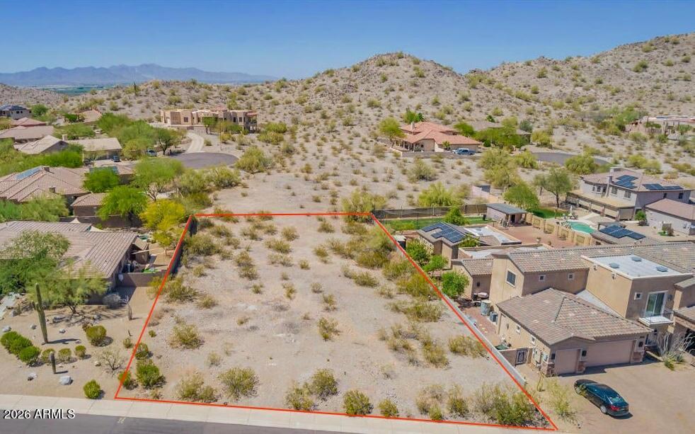 Located in the master-planned community of Estrella Mountain Ranch, this 0.42-acre residential lot at 18454 W Porter Dr, Lot 28, Goodyear offers an excellent opportunity to build a custom home. The lot is situated within an established subdivision and provides access to Estrella's amenities, including trails, parks, and community features. Level terrain and generous lot size allow for flexible design options, subject to HOA and city approvals.