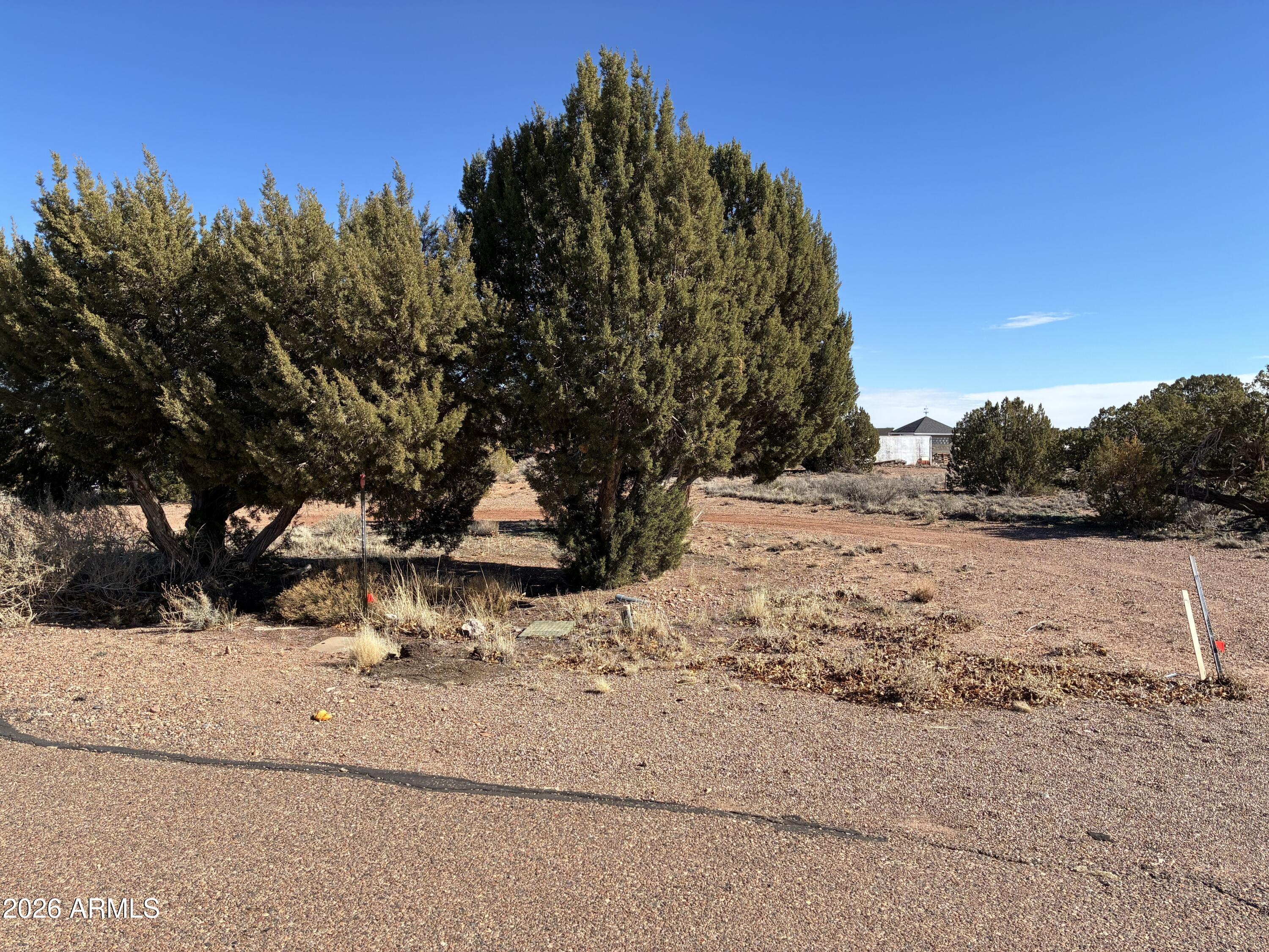 This is a great lot to build a beautiful house, just over an acre with great views, and dual access from both; the cult the sac, and one of the main streets (Country Club) in the neighborhood. Near the golf course, and close to downtown shops, and restaurants. Make us an offer!!