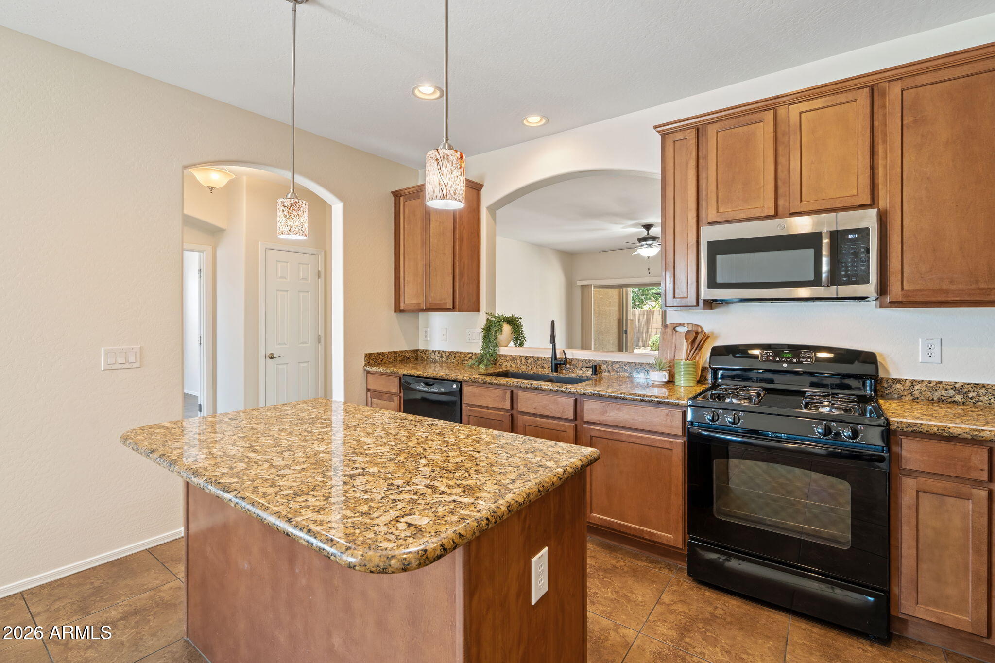 Welcome to this beautifully maintained single-level home in the highly desirable Shamrock Estates community, just minutes from Gilbert Regional Park. Offering 3 bedrooms, 2 bathrooms, and a versatile den, this thoughtfully designed floor plan provides the flexibility for a home office, playroom, or additional living space. Freshly updated with new interior paint and brand-new carpet in the bedrooms, this move-in ready home combines comfort and style. The split-bedroom layout offers added privacy, while the eat-in kitchen features a partial opening to the main living area, creating the perfect balance of openness and defined spaces for everyday living and entertaining. Step outside to a spacious backyard featuring low-maintenance desert landscaping and a charming pergola, providing the perfect spot to relax with your morning coffee or unwind in the evening. With ample room to personalize the space, there's plenty of potential for a pool, expanded patio, or your own backyard oasis. Situated on a generously sized lot and meticulously cared for, this home offers exceptional value in one of Gilbert's most sought-after communities. Conveniently located near parks, shopping, dining, and top-rated schools, it's ready for its next owner to move in and enjoy.