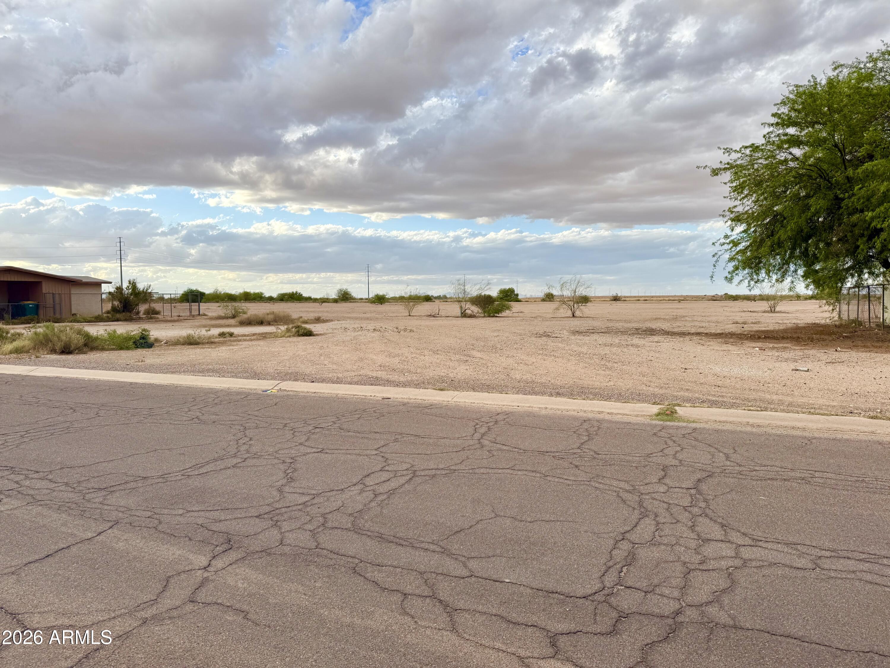 Hard to find lot in the neighborhood of Eloy North has city utilities and services available for your new build new including: water, power, sewer, phone, and gas.  With nothing but open space behind you, this lot has views, and tons of privacy very few properties can provide. Come see it for yourself!
