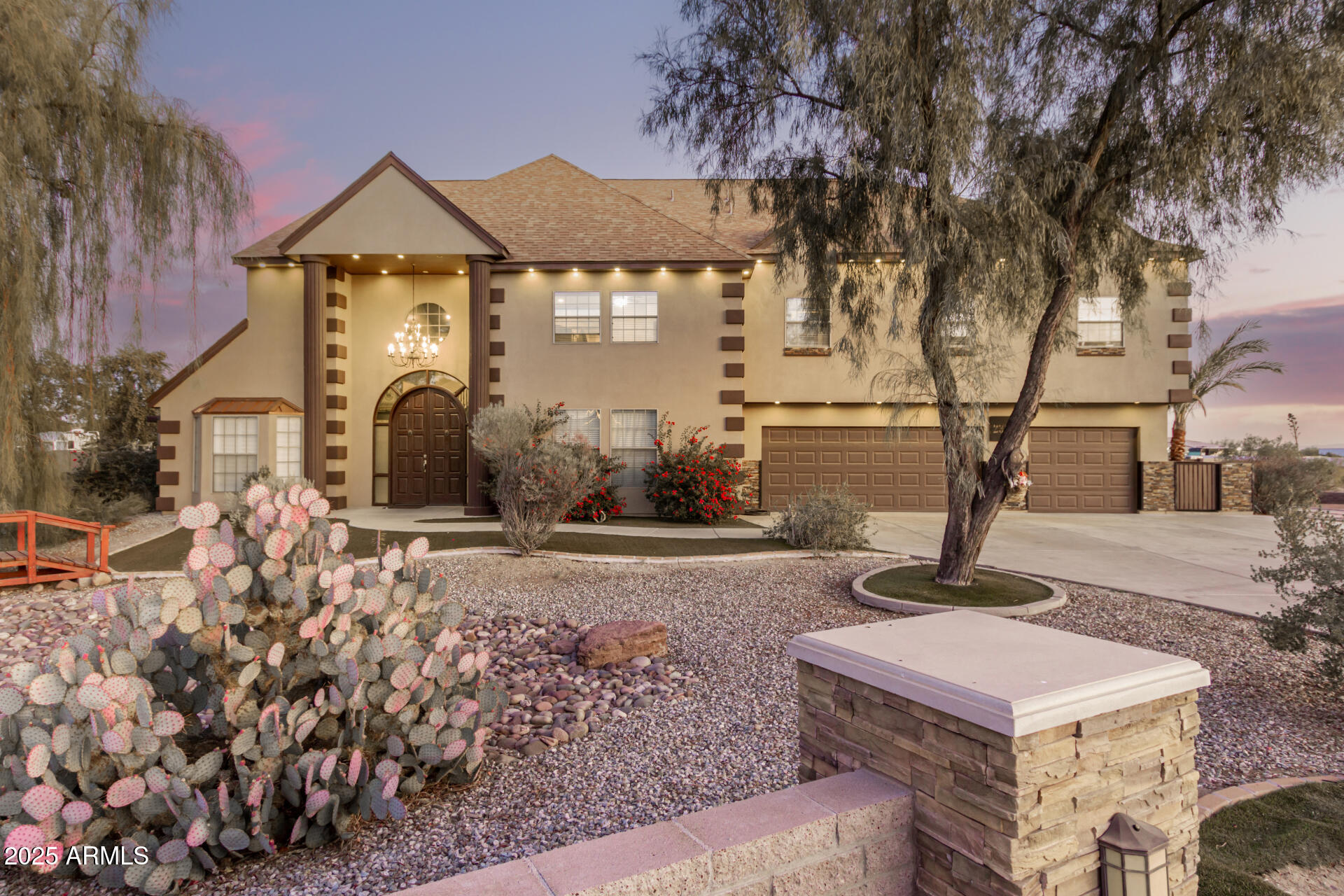Step into unparalleled luxury with this stunning 6-bedroom, 4-bathroom estate. Set on a sprawling 1-acre lot, this home boasts jaw-dropping curb appeal, complete with a beautifully maintained desert landscape and low-maintenance turf. The oversized 4-car garage and RV gate provides storage for all your needs. Inside, the grand dining and living areas feature soaring ceilings and eye-catching light fixtures that create an atmosphere of elegance. You'll find gorgeous flooring and a striking stone fireplace. The gourmet kitchen is an absolute dream with custom wood cabinetry, granite countertops, and a stylish tile backsplash. Built-in appliances, including dual wall ovens, a walk-in pantry, and an island with breakfast bar. Don't miss your chance to own this exceptional home!!

Don't forget about the sizeable den, perfect for an office or even a library! Upstairs you will find a cozy loft where you can spend a relaxing Sunday afternoon. The gran primary suite showcases a private sitting room w/stylish French doors, direct balcony access, a 2nd fireplace, a walk-in closet, and a lavish bath w/dual vanities & a jetted tub. Finished basement boasts a 2nd kitchen area and a large bonus room ideal for an entertainment center! Lastly, the expansive backyard includes a covered patio, multiple seating areas, well-laid pavers, a lovely pergola, basketball court, and a fire pit! This is the opportunity of a lifetime, hurry and act NOW!