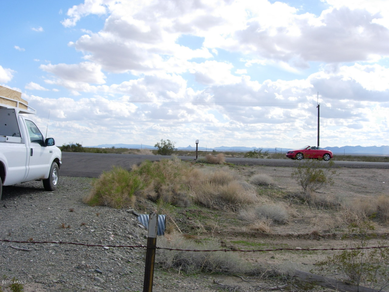 THE 1,161 ACRES IS PRICED AT 5,224,500 IN THE (MVWCDD) IRRIGATION DISTRICT. PART OF IT HAS BEEN FARMED IN THE PAST. THERE IS A CAPPED WELL ON THE PROPERTY. THE DISTRICT WILL APPROVE MORE WELLS FOR FARMING OR ALMOST ANY OTHER TYPE OF DEVELOPMENT. THE LAND IS OUTSIDE OF THE AMA AT THIS POINT AND LA PAZ COUNTY NEEDS ALL TYPES OF PROJECTS TO INCREASE THEIR TAX BASE. SO BRING YOUR DREAM OR MASTER PLANNED COMMUNITY TO LA PAZ COUNTY. THIS AREA IS FAST BECOMING THE NEXT RED HOT RETIREMENT AREA IN ARIZONA. THIS AREA KNOWN AS THE ARIZONA OUTBACK IS FULL OF WILDERNESS AREAS, BLM & STATE LAND FOR HIKING, BIKING AND ATV RIDING. FISHING IN LAKE ALAMO AND ALONG THE WEST BOUNDARY OF LA PAZ COUNTY THERE IS THE COLORADO RIVER. BOATING, FISHING, JET SKI'S THIS IS THE NEW ACTIVE RETIREMENT AREA IN ARIZ.