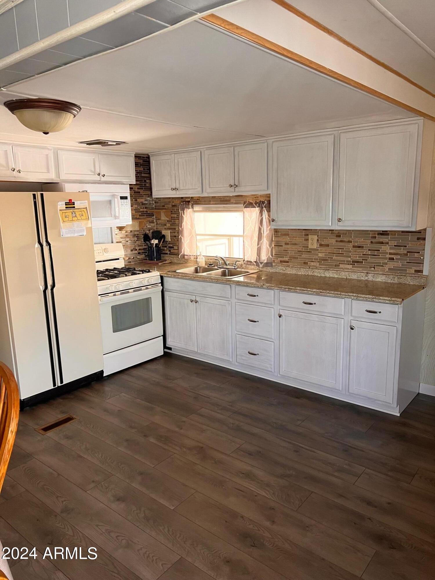 Furnished unit located in the 55+ Community Mesa Village. 

Move in ready with beautiful vinyl plank flooring, wood accents on the walls, kitchen tile backsplash. This is a 2 bedroom, den and additional bedroom/az room has been added on. 

Perfect for visiting friends/family. There is plenty of storage space throughout the unit with the addition of an outside storage shed that will be available for use.  The spacious dining room is great for gatherings and get togethers. This unit is also located directly across from the mail boxes and laundry rooms for greater convivence.

Enjoy the spa and whirlpool, challenge your friends to a game of pickleball or try your luck on the shuffleboard court. For a more leisurely activity, head to the billiard room, library, or workout facility.