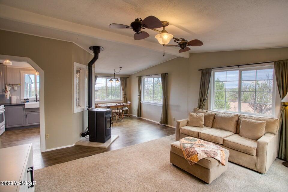 Beautifully updated 1040 s.f. 2 bdrm 2 bath mfg home with an addition been exquisitely remodeled with top-of-the-line upgrades & stylish finishes throughout - distinctive taste & immaculate attention to detail! The 288 s.f. screened porch can be additional, fresh-air living space for most of the year (which is why it's included in the total square footage!). There's power, well, & septic; the private, fully fenced 38 acre parcel has excellent tree cover, inc fruit trees. Outbuildings include a large wooden barn w/loads of character (needs TLC), a solid & squeaky clean well house, a metal storage bldg, 2 tool/toy shelters, & a single wide trailer that's been nicely maintained & used as a woodworking shop. Great access, mostly paved. Pride of ownership is evident, & the road access is great! The Property Disclosure and Well Disclosure are in the Documents tab of this listing. FYI, a Murphy bed is installed in the second bedroom, and there are upgraded fans and skylight & transom treatments, as well. The landscape is dotted with petrified wood and other 'finds' like arrowheads, and there are other attractive outdoor features such as a waterfall, block planter beds, grapevines, etc.. It would be well suited to being a horse property, with miles of good riding all around - private and serene area. Well is 280' deep, and the water level is at 220'.  
All in all, this is an extraordinarily nice property that has been lovingly cared for over the years and is now ready for a new chapter!