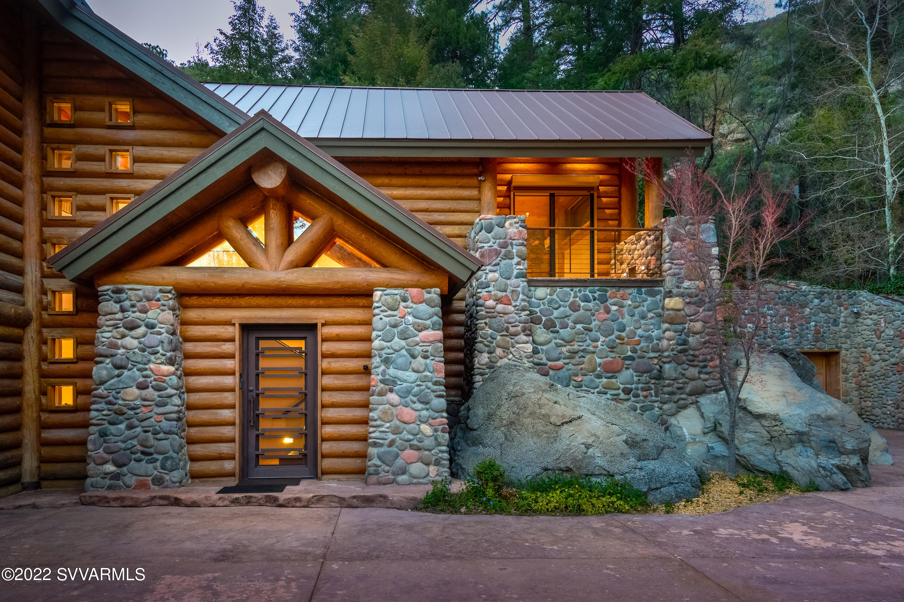 An architectural Mountain Masterpiece in Oak Creek Canyon SEDONA. A masterfully crafted and designed home, expertly showcasing the  substantial timbers, the expertly honed stone floors  & the SPECTACULAR CANYON VIEWS  from this hillside location. The result is a place of balance and beauty, in harmony with its surroundings.

At almost a 1000 feet higher in elevation than Sedona, where the evergreens are profuse, creek sounds soothing and mountains views breathtaking!   Yes it really is 68 degrees in June!

SHOWINGS by Appointment to pre-qualified buyers Monday through Friday at noon. No weekend showings.

Junipine Estates enjoy 10 acres of common area along creek, an apple orchard and the 100 + year old historic Purtyman Cabin A trail runs alongside Oak Creek meandering along the 10 acres of common are and beyond. Retreat on Oak Creek to pure peace & inspired awe...

* Backs National Forest
* Theater 
* On Private Sewer
* Private Water Company
* 10 Acres Common Area
* Indulgent Owners Suite
* Waterfront Property
* Designed for Chemical Sensitive
* Dual Ovens
* Honed Solid Stone Floors
* Induction Stove
* Massive Wood Timbers
* Rolling Shutter Exterior Electric Window Blinds 
- - - - Secure, black out & Keeps It Cool
* All Electric Interior Blinds
* Boulder Waterfall Spans Two Levels
* Designer Recessed Lighting
* Elevator For Ease
* Indoor & Outdoor Fireplaces
* Kitchenette Off Theater Room
* Owners Suite with Two Sided Gas Fireplace
* Two Sub Zero Refrigerators
* Two Walk-In Closest In Owners Suite

Retreat On Oak Creek. Precious few call this special location home.