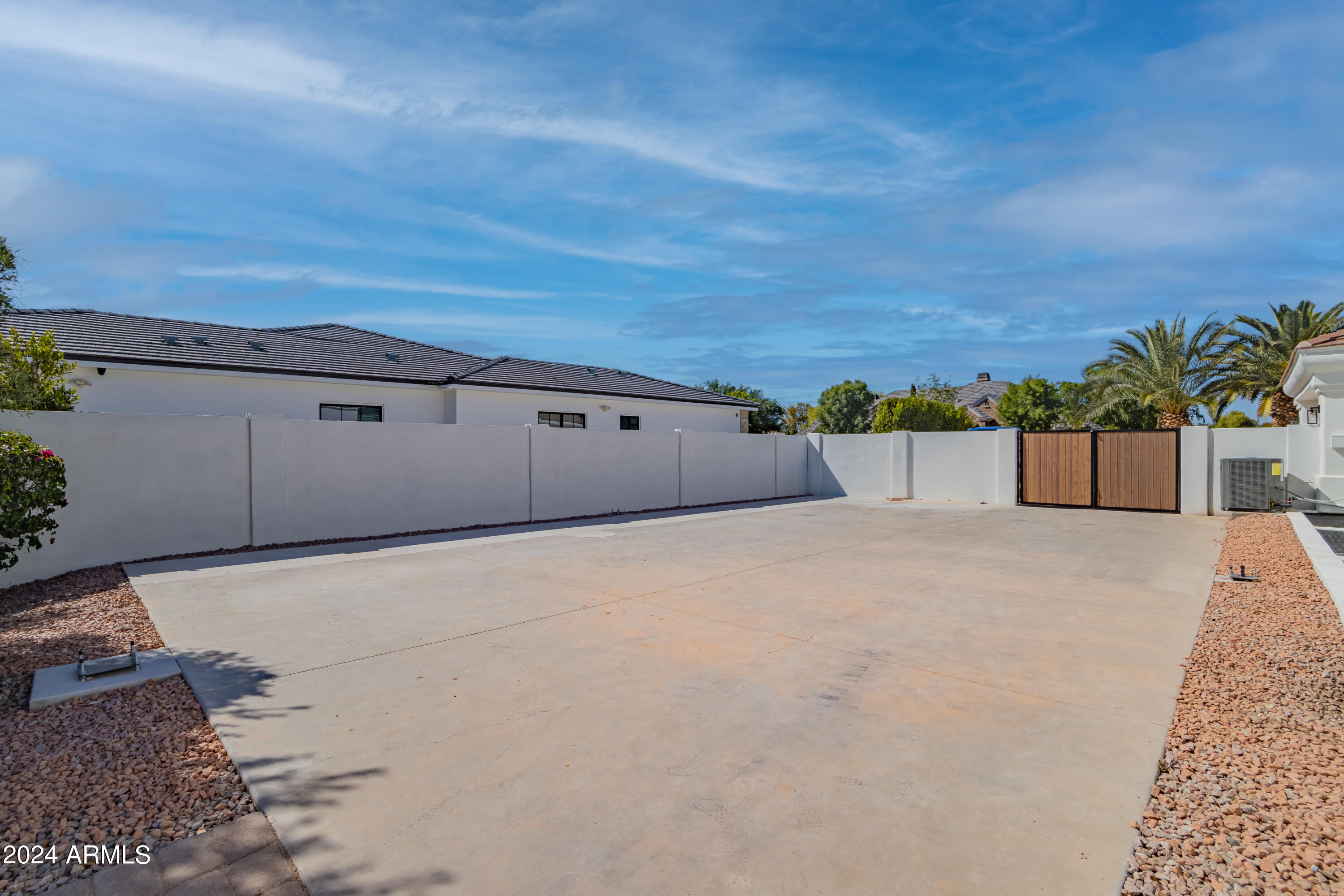 Absolutely STUNNING home in one of the most highly desired neighborhoods in the east valley. Complete gut and remodel that will leave you speechless and ready to write an offer. This property has everything you are looking for!  Great neighborhood, Great floor plan, basement w 10 ft ceilings, detached casita, and a huge pool. Remodel included extending the covered patio, adding two sets of bi-fold stacking doors, adding an additional ensuite bathroom, creating a 2nd master closet complete with washer/dryer hookups, all new finishes throughout, creating a large travertine patio, expoxied garage floor, extended cement pad ready for a pickleball/bball court, added washer/dryer hookups in the casita along with SO SO much more. Do NOT hesitate to see this home it will sell very quickly!!