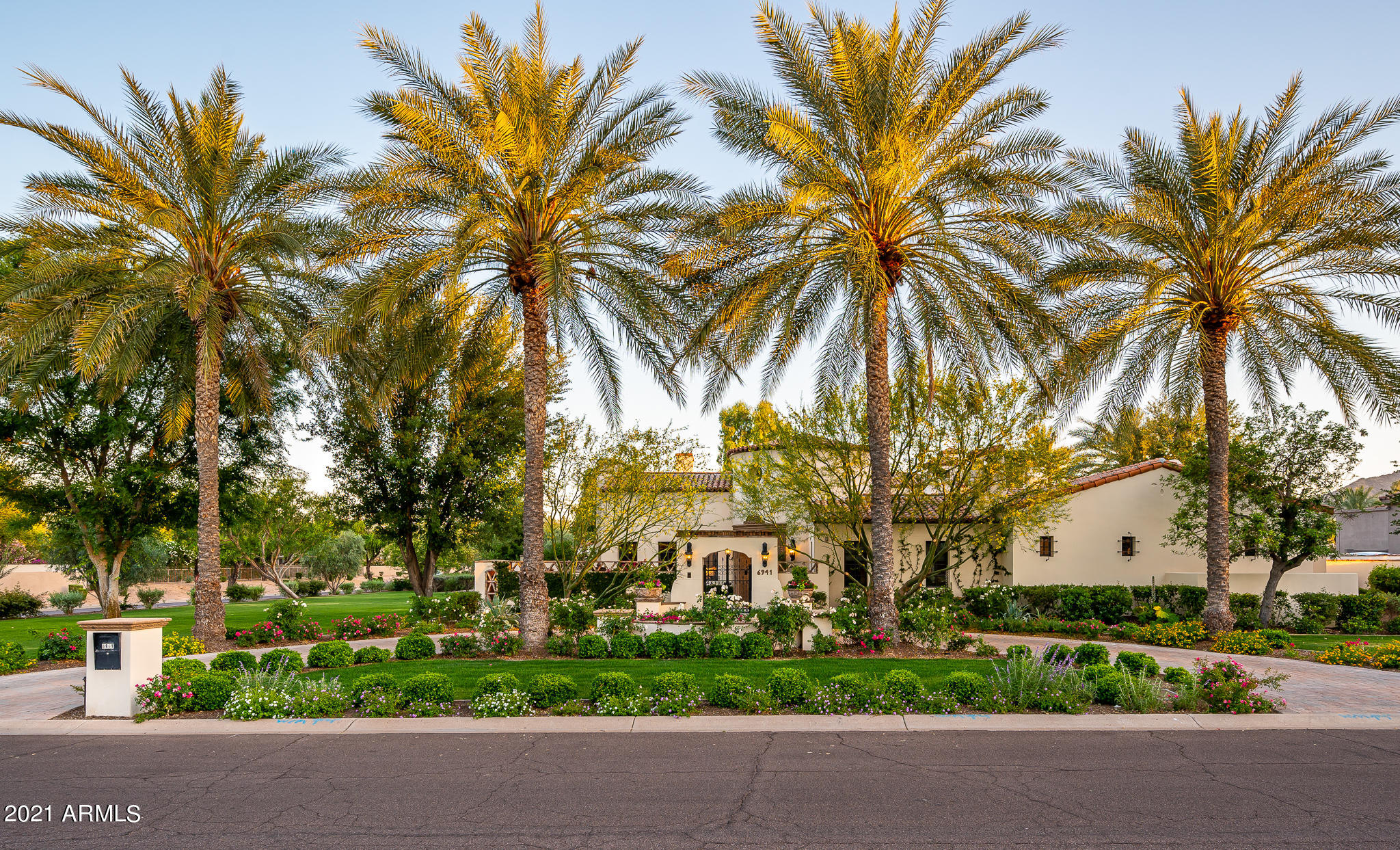 Don't miss out on this classically sophisticated Santa Barbara style estate, located in the prestigious Paradise Valley community. The owners thoughtfully upgraded the interior and exterior of the home with Salcito Custom Homes and had the grounds overhauled and meticulously maintained by Berghoff Design Group. No detail was overlooked. The single level home sprawls over the expansive acre+ property with six en-suite bedrooms, anchored by an inviting family room and large updated chef's kitchen with a welcoming breakfast area. Natural light enters harmoniously from the interior courtyard and multiple intimate patios, adding to the abundant charm of the home. The attached two bedroom guest suite with its own living room is an added bonus, and allows for the floorplan to be modified for almost any family situation. This stunning estate is enveloped in privacy and lush grounds offering the ultimate in outdoor living with resort style pool, spa, generous covered patio spaces and an expansive lawn. Opportunities abound both inside and out for gathering, formal or informal dining, working and playing. The photos will paint a picture, but seeing is truly believing.
