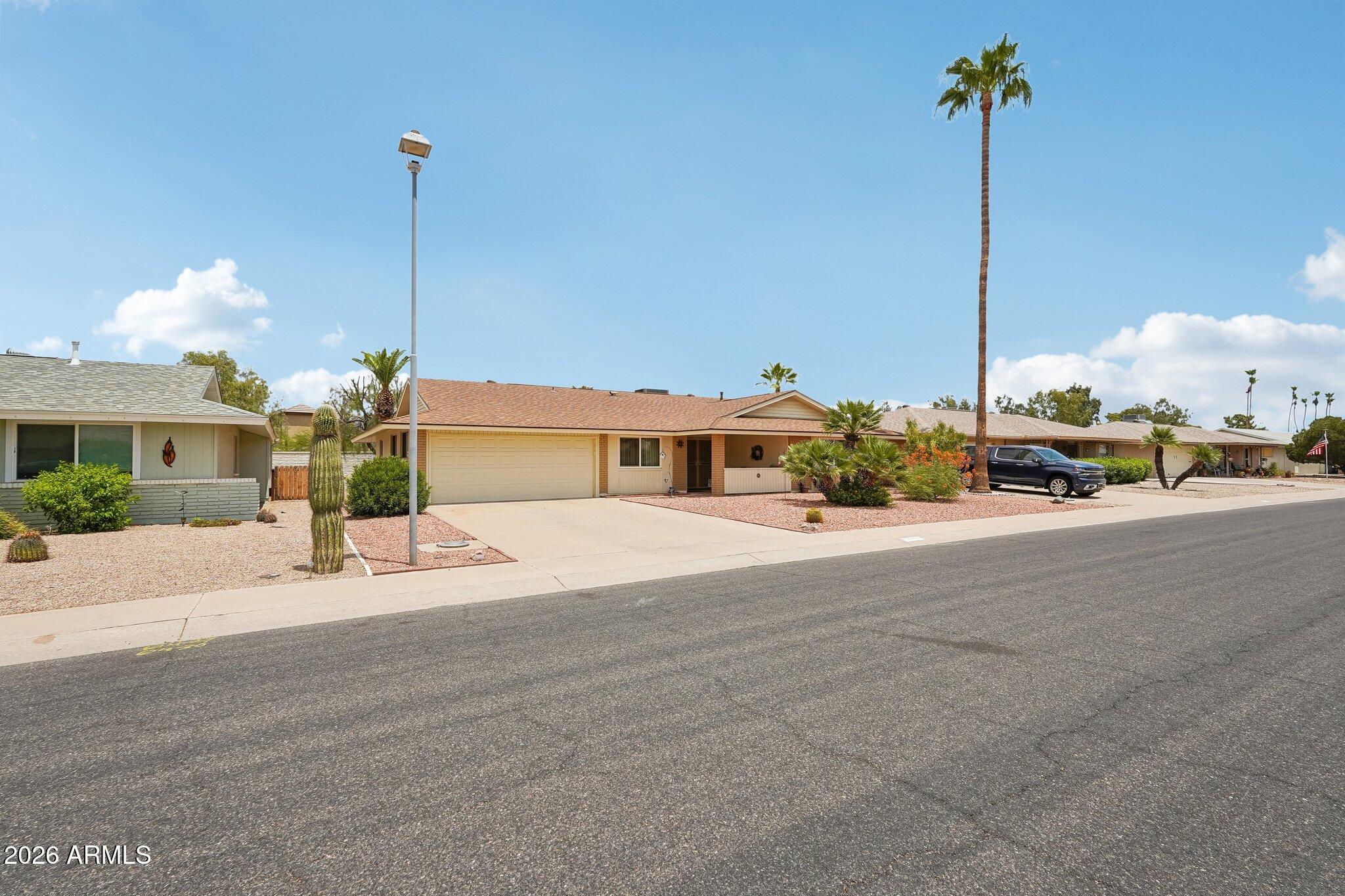 AWESOME UPDATED Expanded 2 BED/ 2 BATH Coconino Model w/ MULTIPLE FLEXIBLE SPACE OPTIONS * 230 Sq Ft AZ Room/ Den * Approx 264 Sq Ft Heated & Cooled Bonus Room for your needs w/ Laundry & GC Parking * Updated Kitchen 2016 w/ Very Nice Cabinetry, Pull Outs, Granite Counters, SS Appliances: GAS RANGE, Micro, DW & NEW FRIG * Beautiful Double Door Entry to a Spacious Living Room * Dining * Primary Suite w/ complete NEW BATH 2025 & Tile Shower * Good size 2nd Bedroom * Full 2nd Bath updated in 2017 * NEW Laminate Flooring & Carpet 2024 * NEW Windows & Slider 2022 * NEW AC & Roof 2016 * Covered Front Porch & Patio w/ Cool Decking * Block Fencing * Updated Landscaping * NEW Sewer Lines - under house 2024 & to street 2017/ 2024 * Block Construction * Sun City has CC&R's, HOA Voluntary to join $25. Home is of Block Construction with Brick Front & Updated with white Siding & Updated Sofits * Welcome to the Active Adult Golf Community of Sun City! The Original Fun City! Sun City offers many amenities & low taxes! 7 Rec Centers with swimming pools, lap pools, walking pools, Hot tubs and every activity, work shop, & craft you can think of! Bowling! Pickleball! Shuffle Board! Pool Tables! Darts! Tennis! Ground Bowling! Mini Golf! Lake Activities! 8 Public Golf Courses & Reduced prices with Rec Card. And much more! Close to shopping, restaurants & entertainment! Close to Spring Training Base Ball Fields. Close to Arrowhead Mall, Lake Pleasant and all of its growing amenities & restaurants nearby! Close to Grand Ave access & 101 access! The list goes on & on! AGE RESTRICTED RETIREMENT COMMUNITY. ONE PERSON MUST BE 55 YEARS OLD AND NO ONE UNDER 19 YEARS OLDAS A PERMANENT RESIDENT - SCHOA RESTRICTIONS APPLY - REFER TO THE CC&R'S.