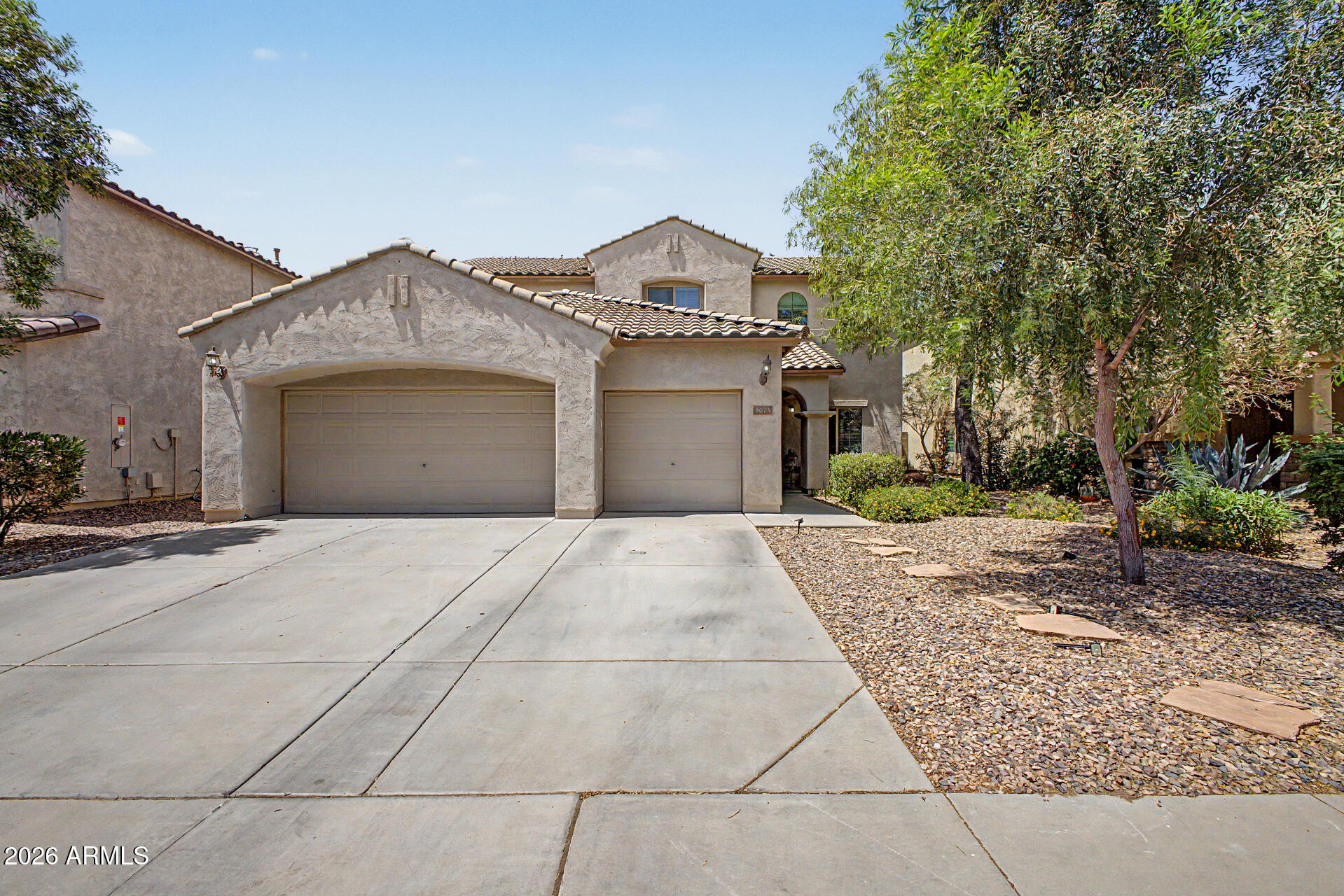 Remarkable two-story home in Anthem at Merrill Ranch! Offering 5 beds, 2 baths + powder room, 3-car garage, & a mature landscape. The inviting interior features tons of natural light, a neutral palette, and carpet/laminate/tile flooring throughout. You'll love the formal living & dining room and welcoming family room that opens to the kitchen! SS appliances, a pantry, recessed lighting, breakfast area, sliding doors to the back, and wood cabinetry w/crown molding make up the culinary space. Large main bedroom is downstairs! It has an ensuite with dual sinks, separate tub/shower, & a walk-in closet. HUGE loft upstairs, ideal for a TV or game area! Also including the sizable secondary bedrooms, each boasts a walk-in closet. Enjoy the spacious backyard with a covered patio to relax! Just WOW!