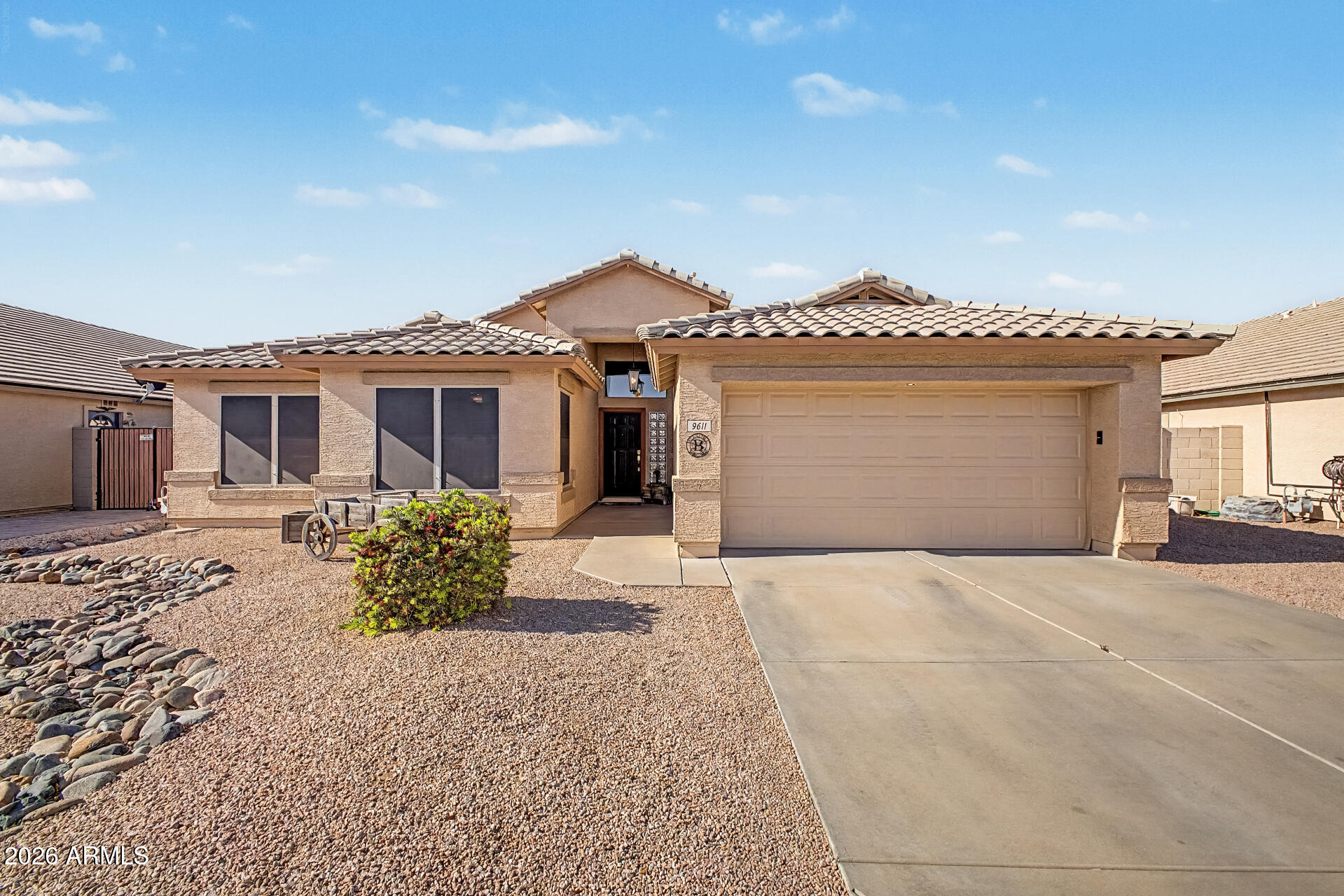 Searching for a 3-bedroom plus den home with a pool in East Mesa, near schools and with no neighbor behind? This move-in ready home sits on a premium north/south lot backing to open space and is within walking distance to the elementary school, offering both privacy and convenience. The home features vaulted ceilings, extensive 20'' x 20'' tile flooring, accent paint, and 2'' blinds throughout, creating a bright and functional living space. The open kitchen includes a center island with breakfast bar, pantry, ample maple cabinetry, and stainless-steel appliances, with additional storage in the laundry room. The spacious owner's suite features a double-door entry, vaulted ceilings, and private access to the backyard, while secondary bedrooms are well-sized for family, guests, or office use. The den provides flexible space for a home office, playroom, or optional fourth bedroom. Step outside to a backyard designed for entertaining, featuring a large covered patio with ceiling fan and speakers, a PebbleTec pool with in-ground cleaning and water feature, plus a gazebo seating area and paver patio for multiple outdoor living spaces. Additional highlights include an RV gate, new AC unit (2022), and a location close to elementary, junior high, and high schools, as well as shopping, dining, and easy freeway access. If you're looking for a home with a pool, RV gate, den, and no rear neighbor in East Mesa, this property offers space, upgrades, and a highly convenient location.