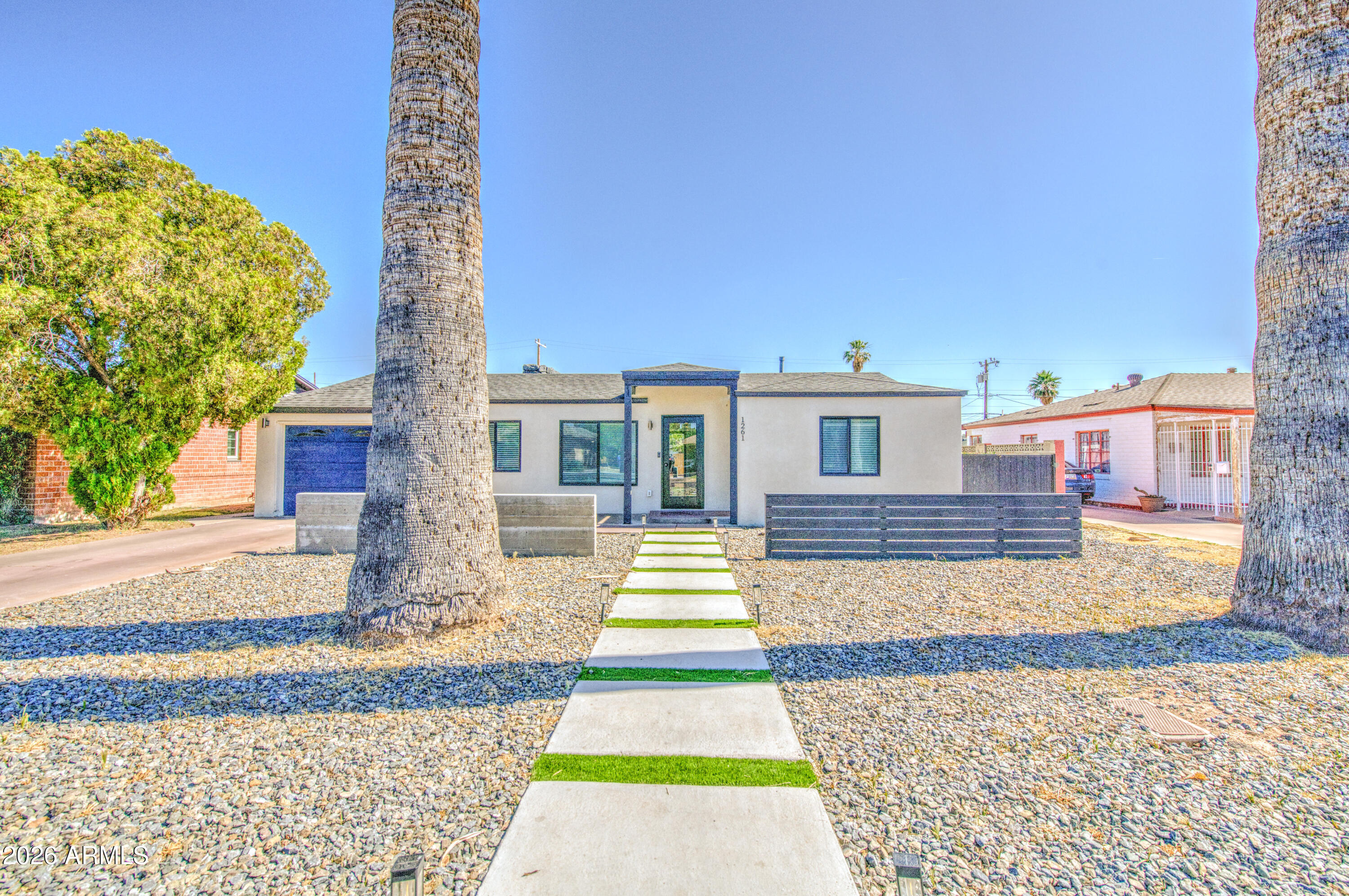 You have found your new home! This beauty has to be seen to appreciate all the amazing upgrades. It has had additions made to the home so it is much larger than it looks from the front of the home. There is fantastic curb appeal and beautiful landscaping. Step inside to an elegant living room with gorgeous tile flooring throughout.  There are separate living & family rooms and the kitchen offers island with breakfast bar, granite countertops, recessed lighting, and contemporary cabinetry. Large bedrooms with two primary bedrooms.  Plenty of room in the backyard for your toys, vehicles, pets, and space to play, entertain, & relax. Ideal starter home if you're a first time buyer. It would also be an amazing rental property. Fantastic location. You won't be disappointed.