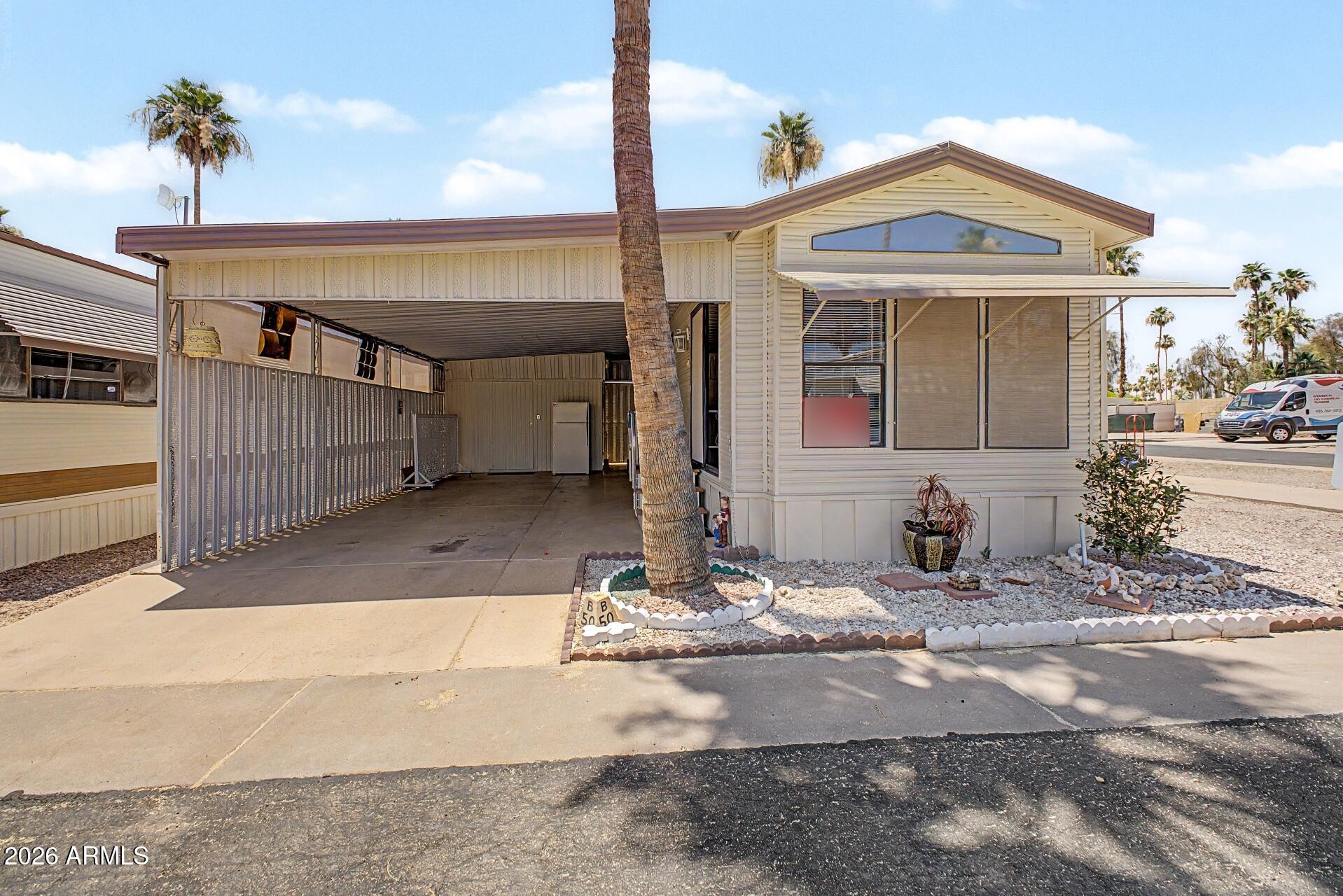 Don't let the size fool you -- this charming, fully furnished home is thoughtfully designed to maximize every sq foot, making it the perfect low-maintenance haven for anyone ready to embrace a relaxed, resort-style lifestyle. Step inside to find a bright, move-in ready interior featuring a newer refrigerator, newer window blinds, & a fully equipped kitchen complete with cookware -- everything you need from day one. The comfortable bedroom boasts a quality newer bed used only seasonally, giving it years of life left. A full tub/shower bath rounds out this efficient & cozy floor plan. Outside, enjoy easy-care landscaping & a covered carport that keeps your vehicle shaded year-round. With a low lot rent of just $660/month, you'll have plenty left in the budget to enjoy everything this vibrant community has to offer.
Because the real living happens beyond your front door. Residents enjoy access to a fitness center, sparkling community pool, spa, billiard rooms, library, shuffleboard courts, horseshoe pits, and on-site laundry facilities -- all within a gated, 55+ community designed for those who've earned the good life. Pets are welcome, too!
Whether you're looking for a seasonal escape and making your Az vacation spot or a full-time residence, this move-in ready gem offers unbeatable value and a lifestyle that feels anything but small.