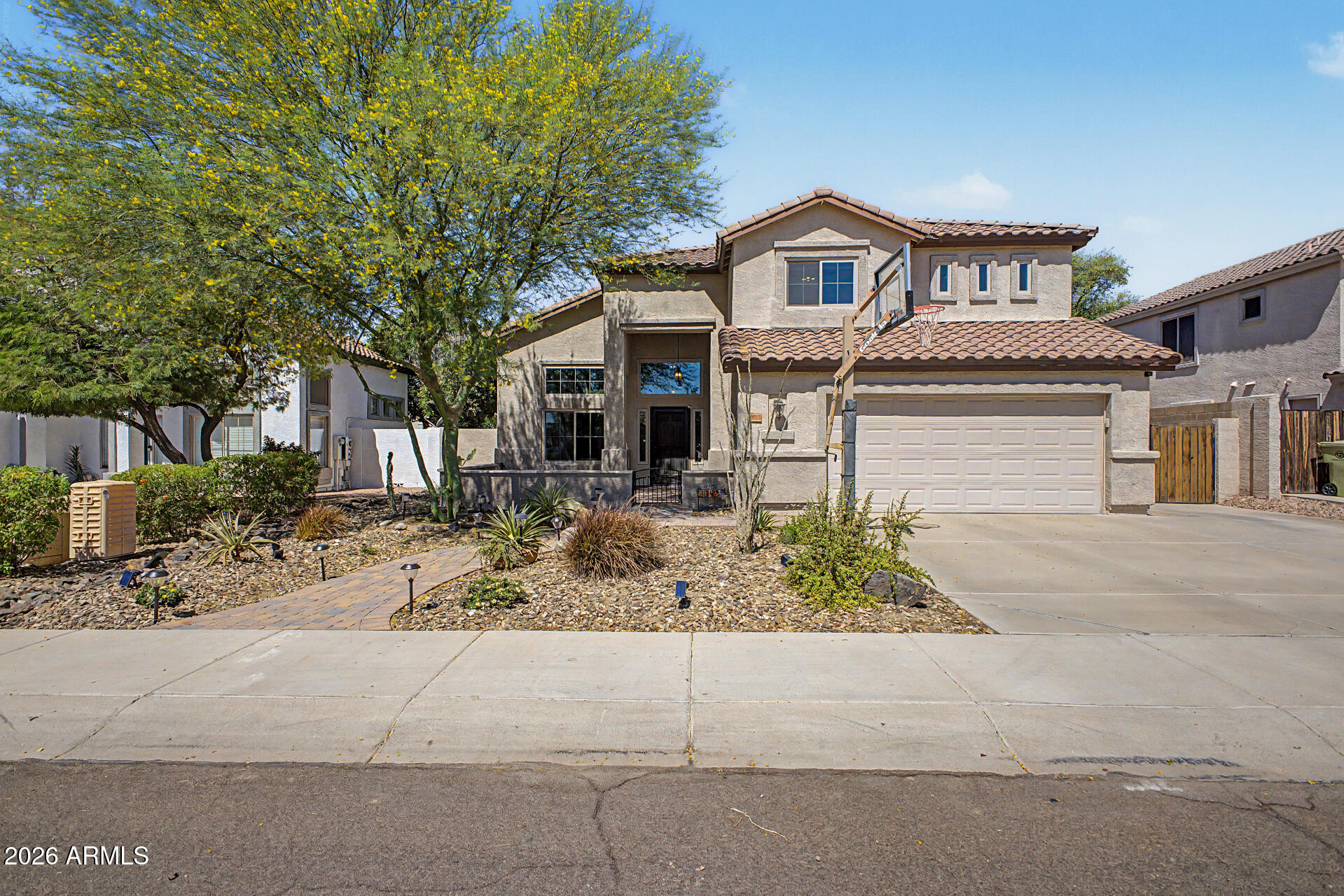 Beautifully updated 4-bed, 3-bath pool home in the desirable Sierra Verde Arrowhead community. This 2,477 sqft home features vaulted ceilings, abundant natural light, a flexible downstairs bedroom/office with full bath, and an updated kitchen with granite countertops, stylish cabinetry, center island, and high-end 2019 appliances. The spacious primary suite includes a private sitting room/den, dual walk-in closets, and a fully remodeled spa-style bathroom with oversized tiled shower and upgraded finishes. Major upgrades include: new pebble-sheen pool and backyard landscape (2015), exterior paint and dual A/C units (2018), roof underlayment and bird stops with 20-yr warranty (2019), new flooring (2019), full primary bath and front-yard renovation (2020), electrical panel (2021), lighting updates (2022), all new energy-efficient windows (2023), interior paint (2024), and water heater and pool pump (2026).
The backyard features a sparkling pool, extended pergola, lighted gazebo, RV gate with double cement pad, epoxy garage flooring, mature fruit trees, playhouse, climate-controlled storage shed, and a beautifully lit front courtyard. Located within the highly sought-after K-8 Sierra Verde STEAM Academy and Mountain Ridge High School boundaries, with a high-school bus stop directly across the street. Community amenities include greenbelts, multiple parks, walking paths, a renovated city park with splash pad coming soon, and close proximity to shopping, dining, gym, and Loop 101.