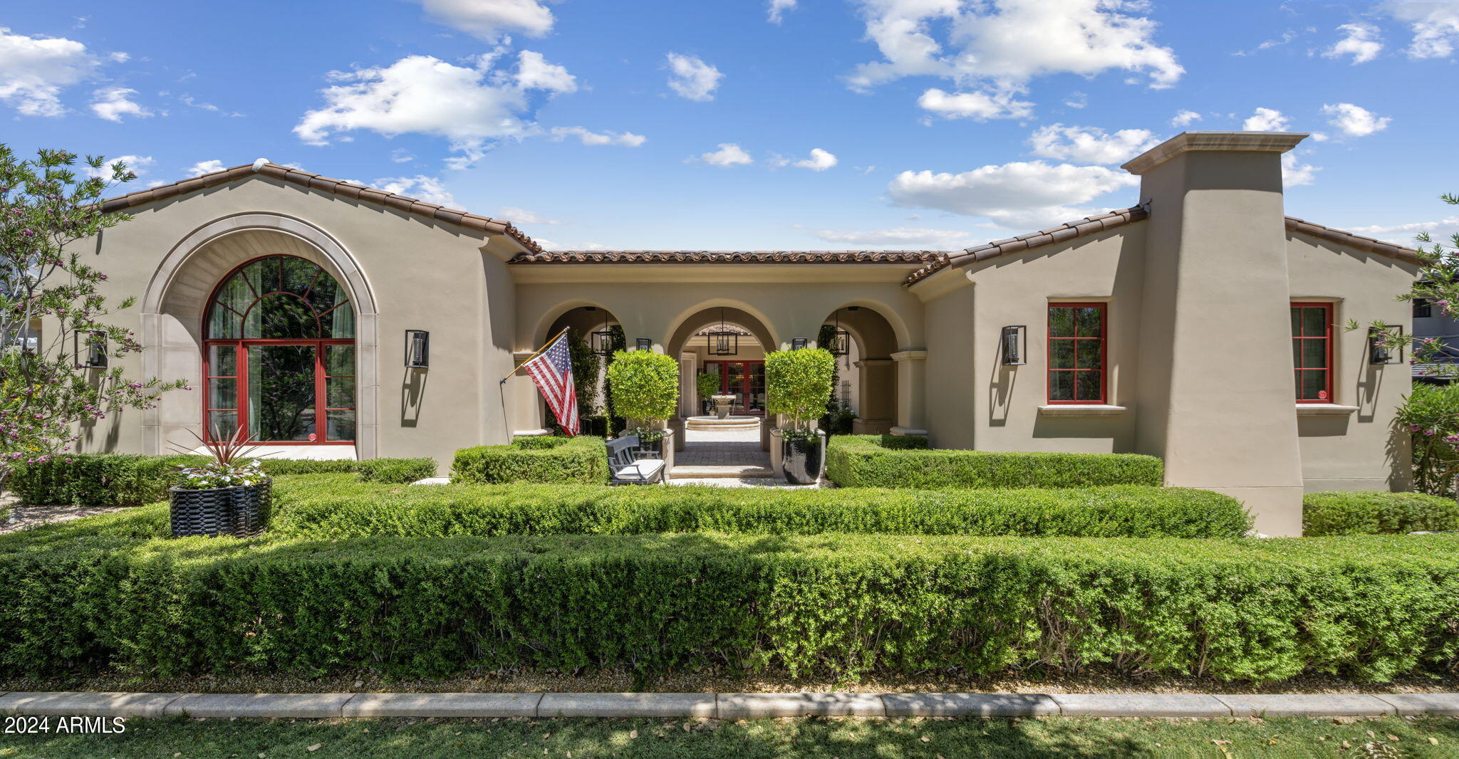 Nestled in the serene enclave of Arcadia at Silverleaf, this exquisite single-level residence exudes a blend of timeless elegance and modern comfort. Boasting five bedrooms, including a charming guest casita, and 5.5 bathrooms, this home offers an inviting sanctuary for both relaxation and entertaining. Step through the welcoming front courtyard into a thoughtfully designed foyer, offering a tantalizing glimpse of the resort-style pool area beyond. A harmonious flow awaits as you enter the great room, where the family room, dining area, and kitchen seamlessly converge, creating an ideal space for gatherings of all kinds. Entertain with flair in the formal dining room, replete with a temperature-controlled wine room and a striking brick groin vault ceiling. The spacious family room beckons with its dramatic stacked stone fireplace and expansive doors leading to the poolside oasis. The chef's kitchen is a culinary delight, boasting custom cabinetry, a generous island, and top-of-the-line Thermador appliances, including a 6-burner gas range and double ovens. A built-in Miele coffee system adds a touch of luxury, while a walk-in butler's pantry ensures effortless organization. Retreat to the opulent primary suite, tucked away for ultimate privacy and featuring a cozy gas fireplace, a serene sitting area, and a spa-like primary bath with dual vanities, a walk-through shower, and a sumptuous soaking tub. Three additional spacious bedrooms, each with its own private bath, offer comfort and convenience, while a media room with a wet bar provides the perfect space for relaxation and entertainment.
For guests seeking their own haven, the private casita awaits, complete with a kitchenette and ensuite bathroom. Outside, the backyard paradise awaits, offering a sprawling covered patio, a soothing gas fireplace, and a heated saltwater pool with a cascading waterfall and spa. Surrounded by low-maintenance desert landscaping and a lush grassy play area, this outdoor retreat is perfect for enjoying the Arizona sunshine in style. Located in the prestigious community of DC Ranch, residents enjoy access to a wealth of amenities, including miles of scenic trails, community parks, and nearby shopping and dining destinations. Experience the luxury living in this meticulously crafted home, where every detail has been thoughtfully curated for the discerning homeowner.