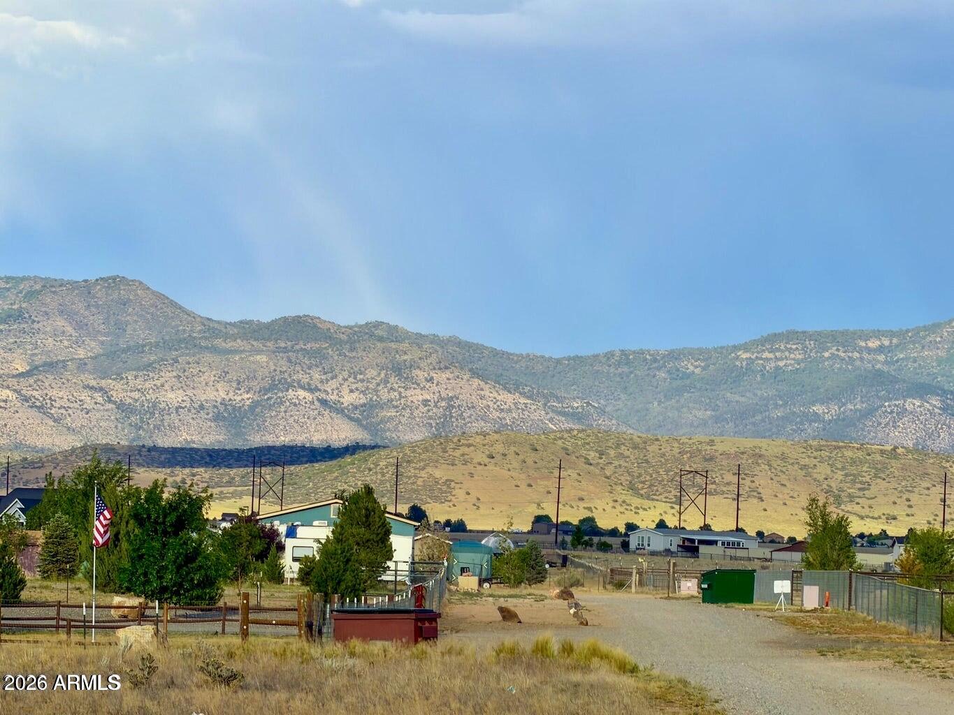 Great opportunity to own a homesite just minutes from Prescott Valley with open-range and surrounding mountain views. The property includes a shared well and offers plenty of room for a site-built or manufactured home. With no HOA or CC&Rs, you'll have the flexibility to use the property the way you want. Enjoy a peaceful setting with convenient access to shopping, dining, schools, medical facilities, and outdoor recreation. ADDITIONAL ACREAGE AVAILABLE. SELLER FINANCING AVAILABLE