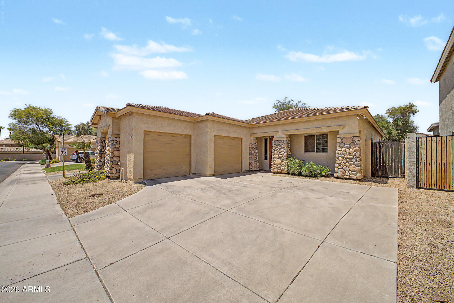 Welcome to the gated Community of Madeline Court, where this charming home awaits you! Providing 2 beds + den, 2 baths, sided 2-car garage, and a mature landscape. The inviting interior features tall ceilings, tons of natural light, a designer palette, and Berber carpet & tile flooring t/out. You'll love the spacious great room paired with sliding doors to the back & surround sound! The kitchen boasts built-in appliances, granite counters, ample wood cabinetry, recessed lights, wine rack, and a breakfast bar. Versatile den w/built-in desk, perfect for an office! Large main bedroom has a walk-in closet and a private bathroom. Tranquility awaits in the backyard, featuring a shade tree and an extended flagstone-covered patio for relaxation or enjoying BBQ. Excellent location! Make this yours!