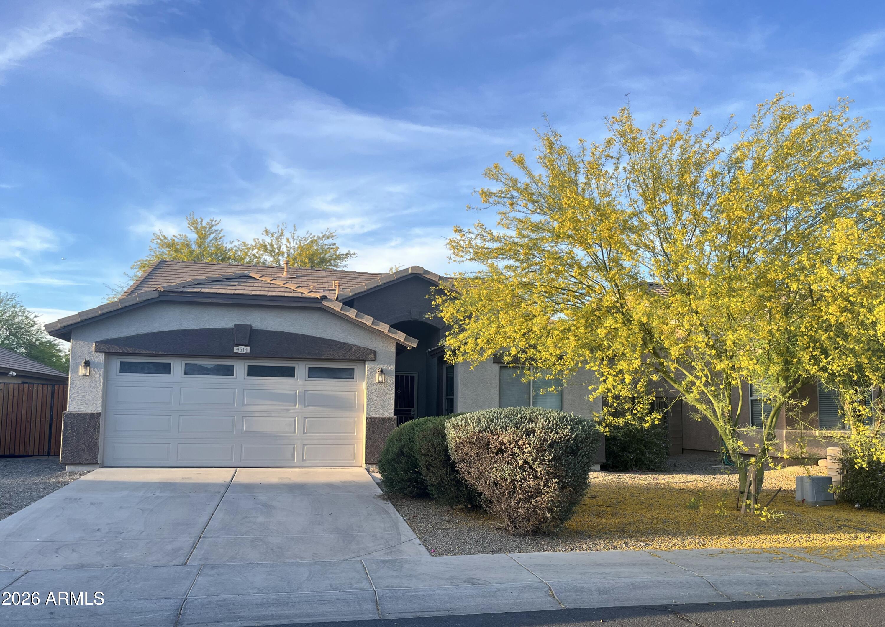 Nicely updated,  move-in ready Laveen home with a backyard designed for entertaining -- located on the greenbelt less than 100 yards from the playground and picnic ramada. Double gate for parking your outdoor toys in the sideyard, low-E windows throughout, easily accessible attic storage above garage, plus a closet organizer in master BR walk-in. Backyard is desert landscaped, with several trees, lots of beautiful flagstone, large fire pit, and deluxe BBQ area. This home is perfect for entertaining and relaxing, and it's been well maintained by only one owner since it was built!