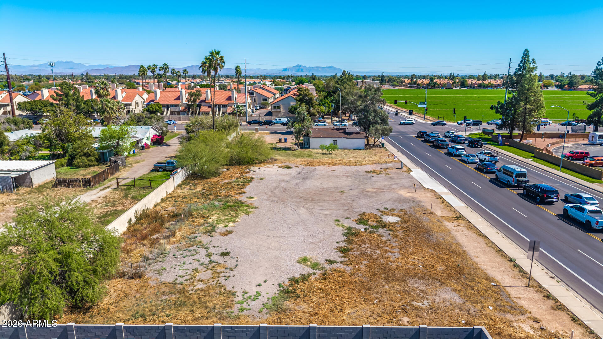 GREAT OPPORTUNITY TO OWN A HUGE PARCEL OF LAND LOCATED ON THE CORNER OF BROWN RD & CENTER ST IN MESA. THIS IS MULTI-USE PARCEL WITH HUGE POTENTIAL. THE PARCEL SIZE IS APPROX. 35,755 SQ FT. THE SELLER HAS RECENTLY INVESTED $150,000 INTO THE CORNER IMPROVED STRUCTURE THAT CAN BE A RESIDENCE, RESTARAUNT, OFFICE SPACE, COUNTRY STORE, OR 4-PLEX.