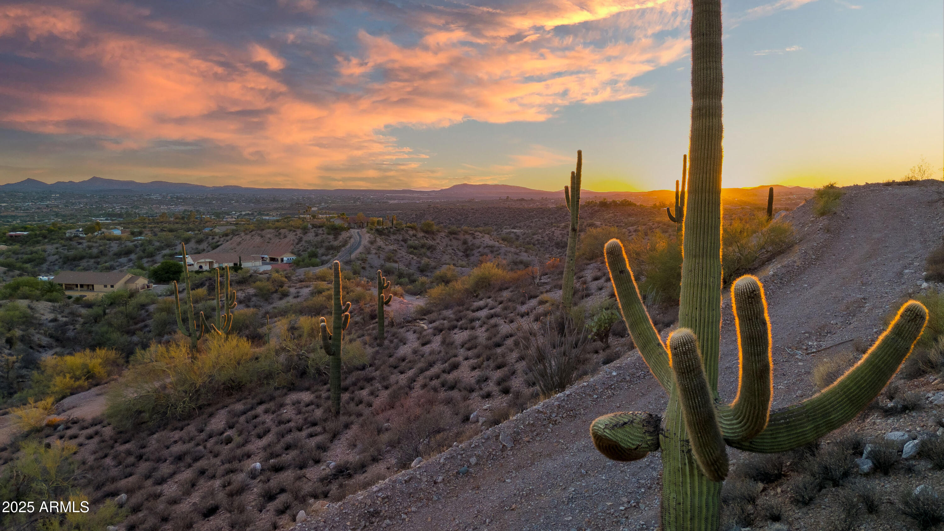 Discover the perfect canvas for your dream home on this hilltop property. Perched above the city, this property offers amazing city views that sparkle by day and glow by night. Iconic saguaros dot the landscape bringing a true sense of timeless desert beauty. Here, peace and privacy are yours without sacrificing proximity to town. With a house pad already leveled, you can envision a modern luxury home, a private retreat or a desert oasis designed to capture every sunset. This property offers unmatched potential in a setting that feels exclusive and serene. Opportunities like this with where natural beauty, views, and location come together are rare. Don't miss the chance to make this one yours.