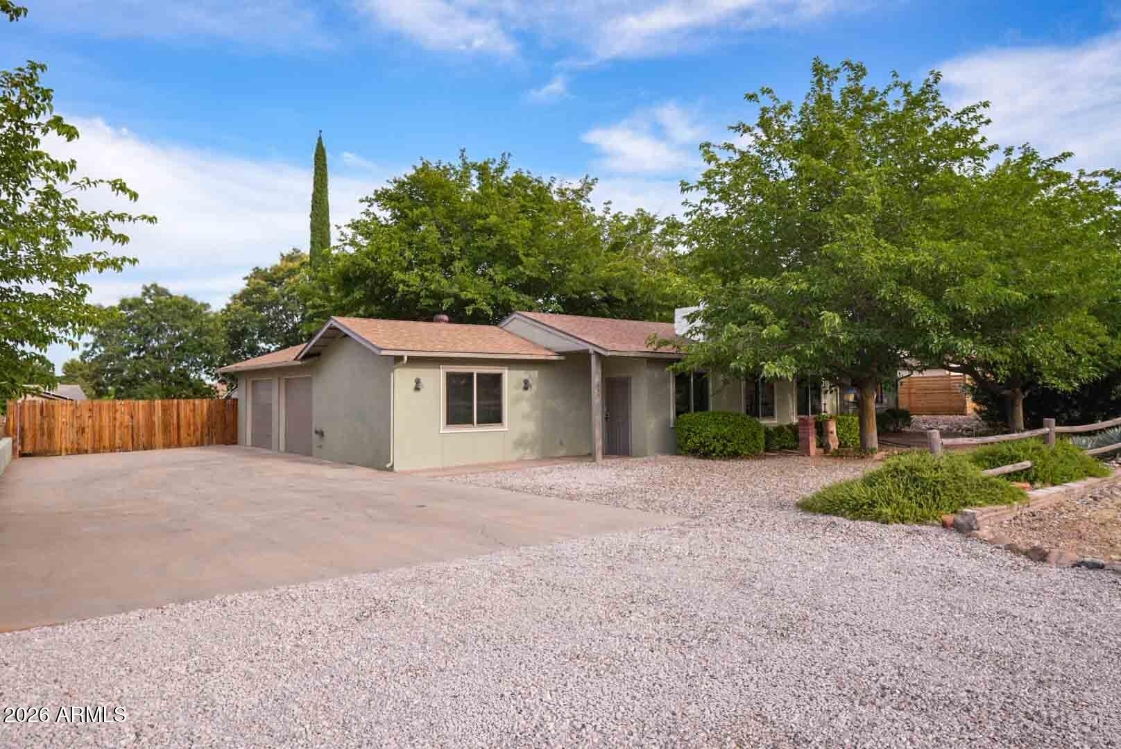 Welcome to 1263 S Monte Tesoro Drive in sought-after Verde Village! This well-maintained, move-in-ready home features a newer roof (2022), all-new Andersen windows, and updated flooring throughout. Enjoy a spacious, fully fenced backyard with mature trees providing shade, privacy, and room to relax or entertain. RV parking and additional space for trailers, toys, or storage add to the property's versatility. Conveniently located near Daniel Bright Elementary School, shopping, dining, and local amenities, this home offers comfort, functionality, and value. Whether you're a first-time buyer, downsizing, or looking for an investment opportunity, this property is ready to welcome its next owner.