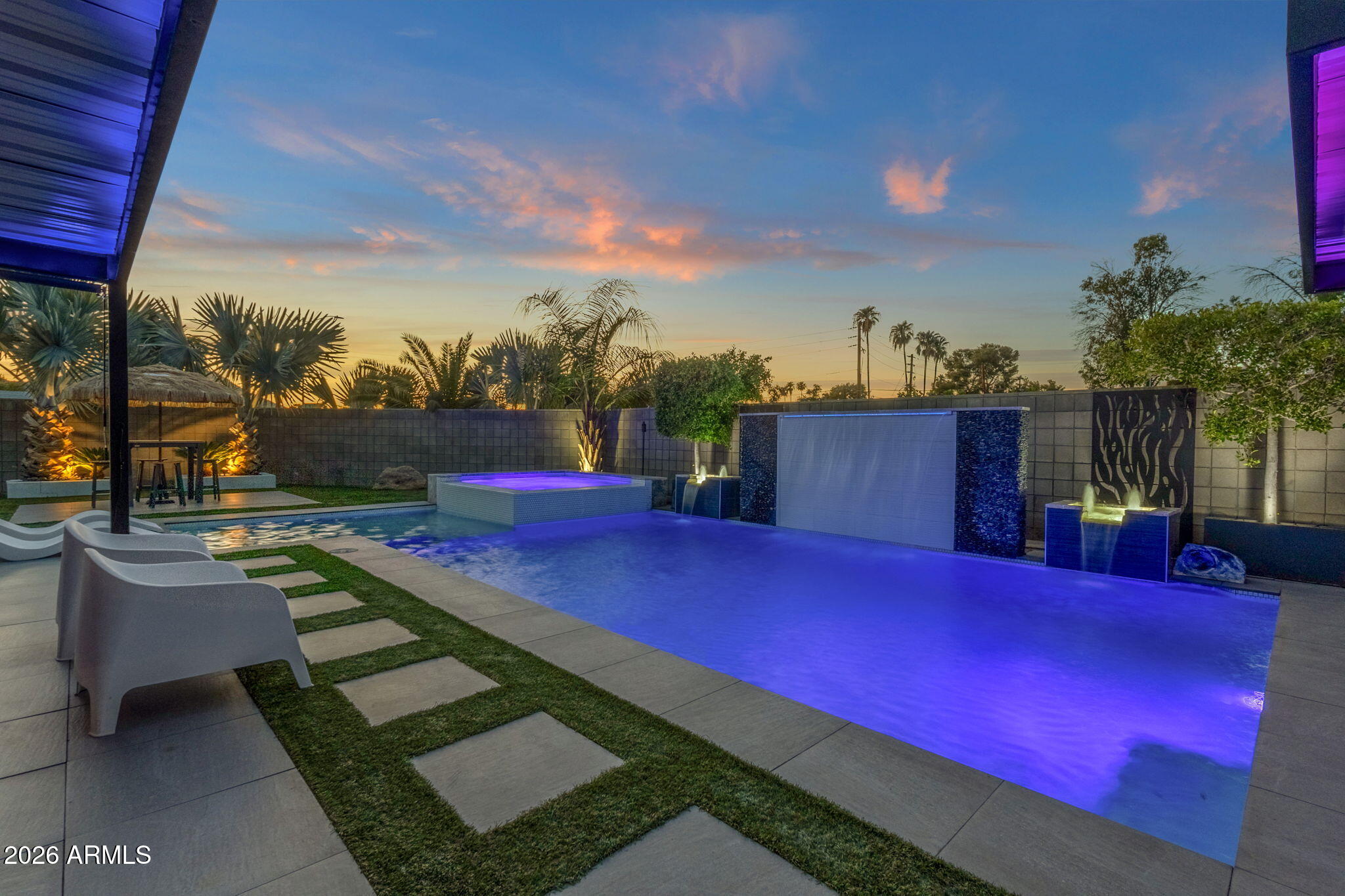 NO HOA + one of the BEST, most convenient locations in SOUTH SCOTTSDALE just minutes from world-famous Old Town Scottsdale. Completely reimagined single-level home with BRAND NEW WOOD LUXURY PLANK FLOORING offering modern design and exceptional outdoor living. Situated on an oversized 11,735 sq ft corner lot, this 2,262 sq ft residence combines contemporary style with resort-inspired amenities. enjoyment, featuring a custom heated pool with raised spa, dramatic waterfall feature, Baja shelf with in-water loungers, color-changing LED lighting, expansive pool deck, covered patio, detached pergola The private backyard is designed for entertaining and everyday , multiple gathering spaces, and low-maintenance landscaping that  creates a true outdoor retreat day or night. The updated exterior showcases clean modern architecture, an extended driveway, two-car garage, and professionally designed desert landscaping with striking curb appeal. Spacious outdoor living areas provide room for dining, relaxing, entertaining, and enjoying Arizona's year-round sunshine.

The entire property is a tech-lover's dream, featuring app-controlled lighting, pool systems, and automated drip irrigation for the mature palms and landscaping. Outdoor entertainment abounds with an in-ground, high-end basketball goal, a golf practice area, and a beautiful front patio complete with a fountain, louvered cover, and privacy wall.  This isn't just a home...it's your private paradise!

Conveniently located approximately 0.1 miles from Chaparral Park and the Indian Bend Wash Greenbelt with miles of walking and biking paths, about 1.5 miles from Old Town Scottsdale and Scottsdale Fashion Square, and minutes from Scottsdale Stadium, golf courses, restaurants, shopping, and Loop 101 access. Whether you're looking for a primary residence, seasonal home, or short-term investment opportunity, this property offers a rare combination of location, style, and exceptional outdoor living.