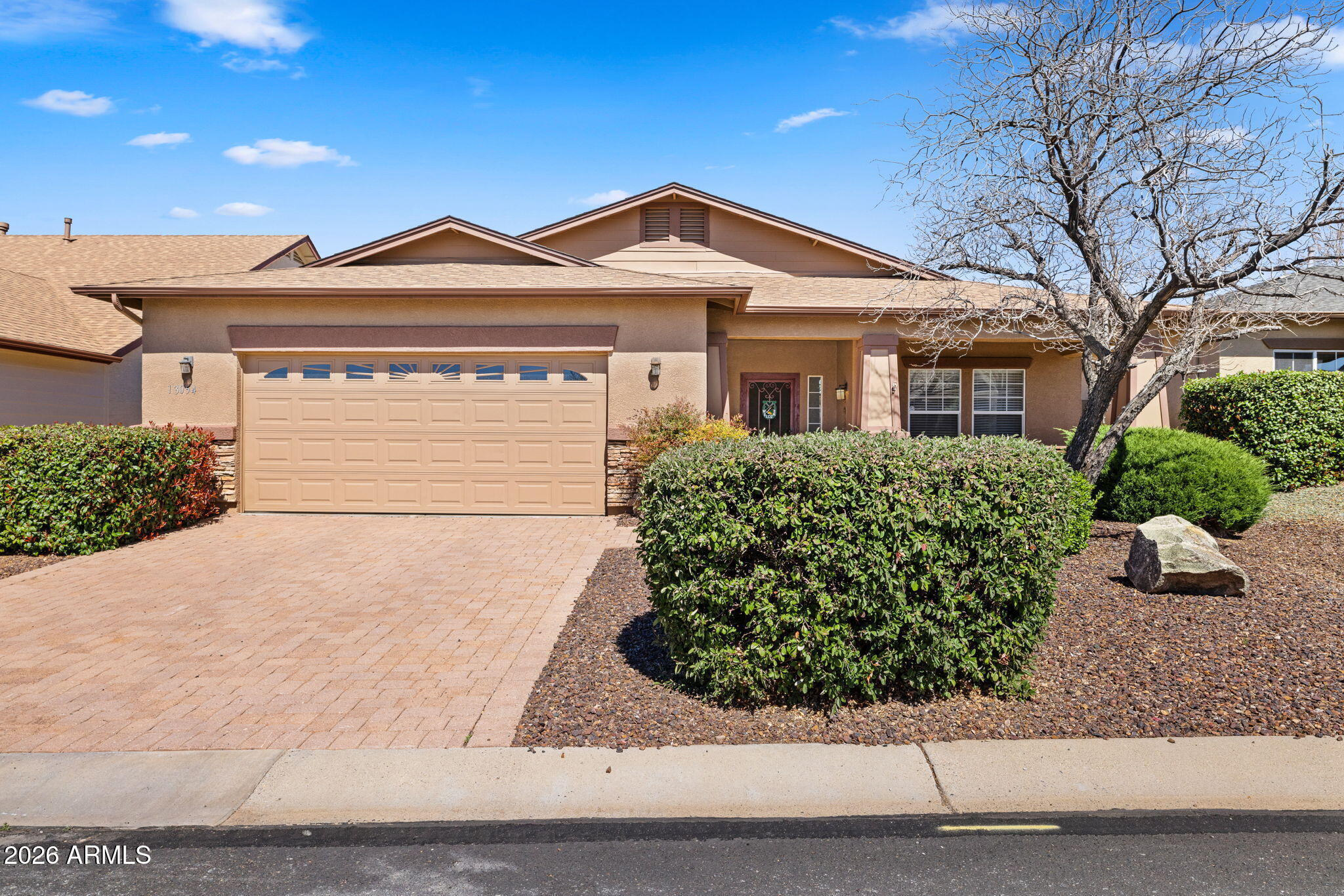 Welcome to 13054 Tijuana Street! This meticulously maintained home is one of the largest argest single level floor plans in Quailwood, offering 1,956 sq ft with 3 bedrooms, 2 bathrooms, plus a versatile den or office that could be converted to a fourth bedroom. Major updates have already been taken care of, including a new roof, new A/C, and Renewal by Andersen windows and slider throughout most of the home, giving you both comfort and peace of mind. Step inside to a warm and inviting living room centered around a cozy gas fireplace. The kitchen and dining areas flow seamlessly together, featuring granite countertops, stainless steel appliances, and easy access to the backyard through the upgraded slider, creating a great indoor-outdoor connection. Start your mornings on the charming front porch with a cup of coffee and unwind in the evenings on the back patio with a glass of wine. The backyard offers a private and low-maintenance space to relax, entertain, or enjoy Prescott's beautiful weather year-round. Living in Quailwood means access to incredible amenities including a clubhouse, fitness center, pool, sauna, tennis and pickleball courts, parks, and more. With its thoughtful updates, flexible layout, and prime location, this home is truly move-in ready. Don't miss your opportunity to make it yours.