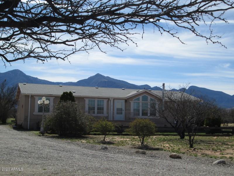 You will LOVE this Spacious Split plan home with AMAZING views! The HUGE efficient kitchen boasts a NEW dishwasher, island cabinet with a breakfast bar, desk, pantry closet, eat-in kitchen area & LOTS of cabinet space. You will love the LARGE master suite with double entry doors & large walk-in closet. Indulge yourself in the master bath complete with a garden tub, 2 sinks, separate shower and plenty of room to move about. The laundry room has space for all those items you need to store and an area for an extra frig or freezer. Enjoy your morning brew on the back covered patio while enjoying the majestic mountain views or enjoy those cool evenings with the warmth of the pellet stove. Don't miss the detached over-sized 2-car garage with workshop and much, much more!