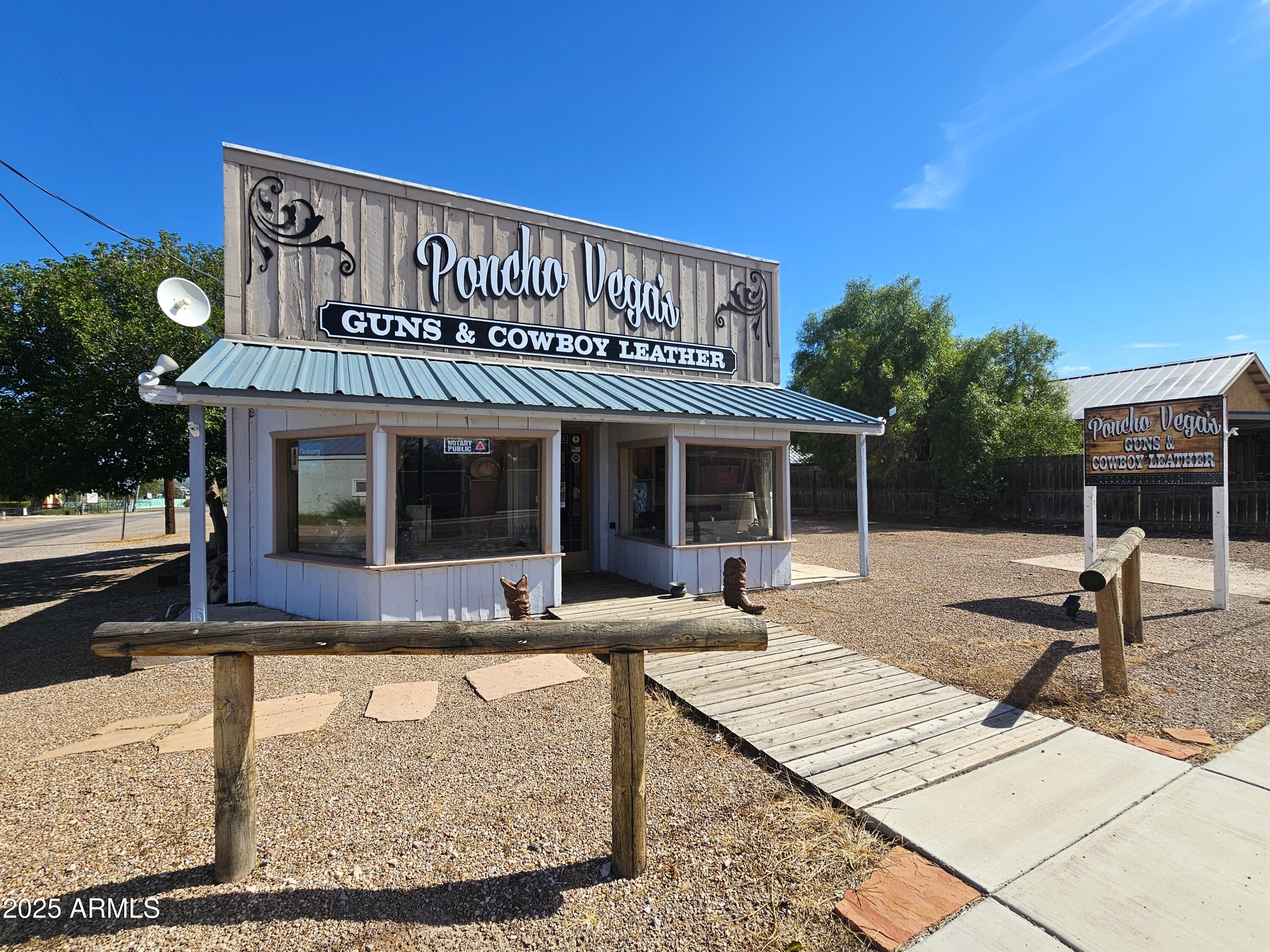 Charming historic-style building with stunning wood floors and ceilings, located in the legendary ''town too tough to die.'' This versatile property offers 1,529 sq. ft. of retail space on a prime corner lot with excellent frontage and plenty of parking?perfect for your Wild West vision.The property can be purchased with or without the existing inventory (available at an additional price). A newer metal roof (installed just 2 years ago), RV parking with hookups, and on-site amenities make it ideal for those who want to run a business and live on the grounds. Inside, you?ll find a bathroom, heating and cooling system, and open retail space (note: no water heater). Currently occupied by an operating business, this location is close to the O.K. Corral and historic Allen Street, offering unbeatable visibility in one of Arizona?s most famous Old West towns.