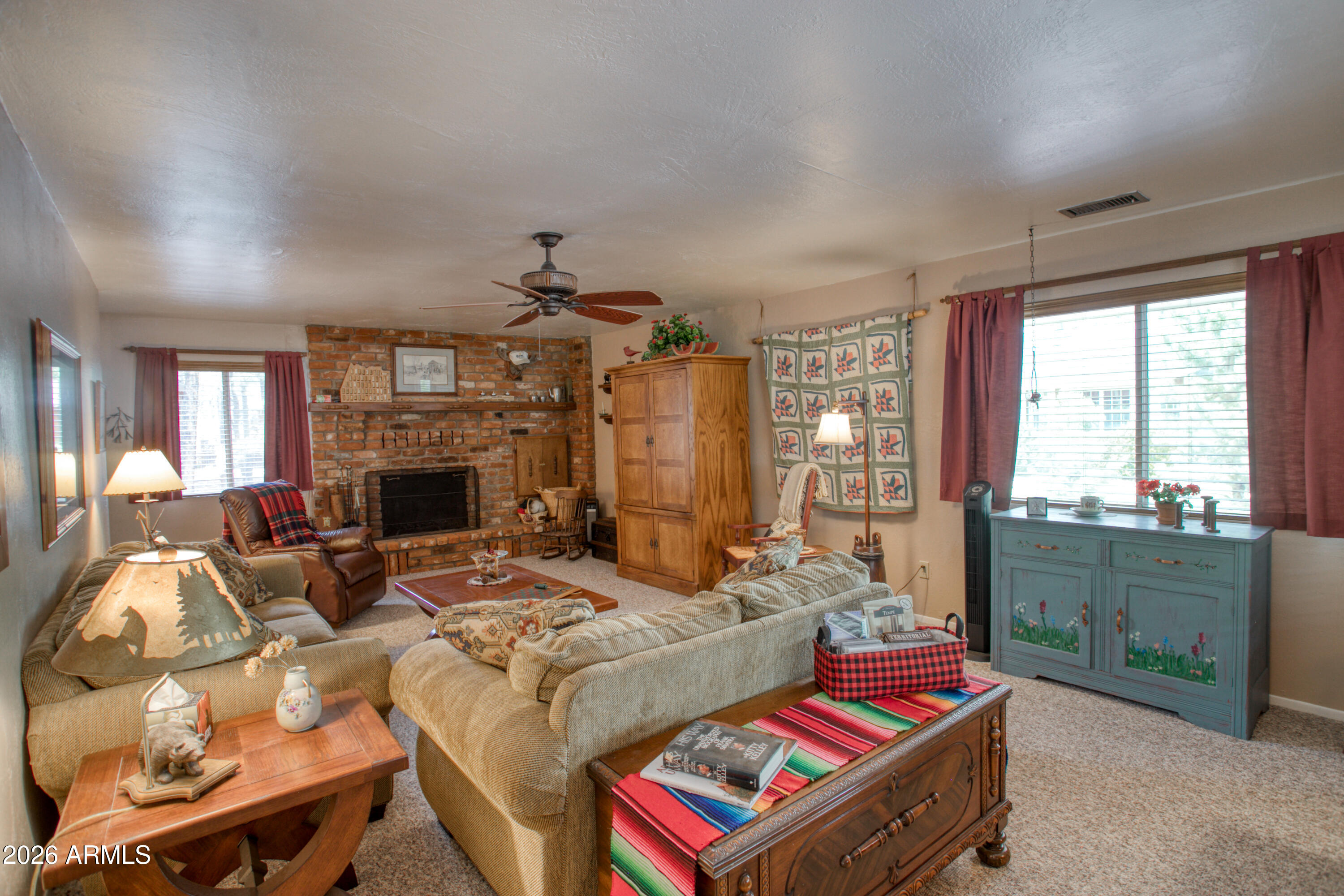 Welcome to your perfect mountain retreat in Pinetop, AZ! This charming single-level cabin features 3 bedrooms and 2 bathrooms, set on a spacious .33-acre lot surrounded by beautiful tall pines. Enjoy a generously sized living room with a cozy fireplace--ideal for relaxing after a day outdoors. The large kitchen offers plenty of room for cooking and dining, highlighted by beautiful granite countertops and ample space for gatherings with family and friends. Updated bathrooms add modern comfort, while the low HOA fee of just $60 per year keeps ownership affordable. A wonderful opportunity to own a peaceful getaway in the pines! Being sold furnished!